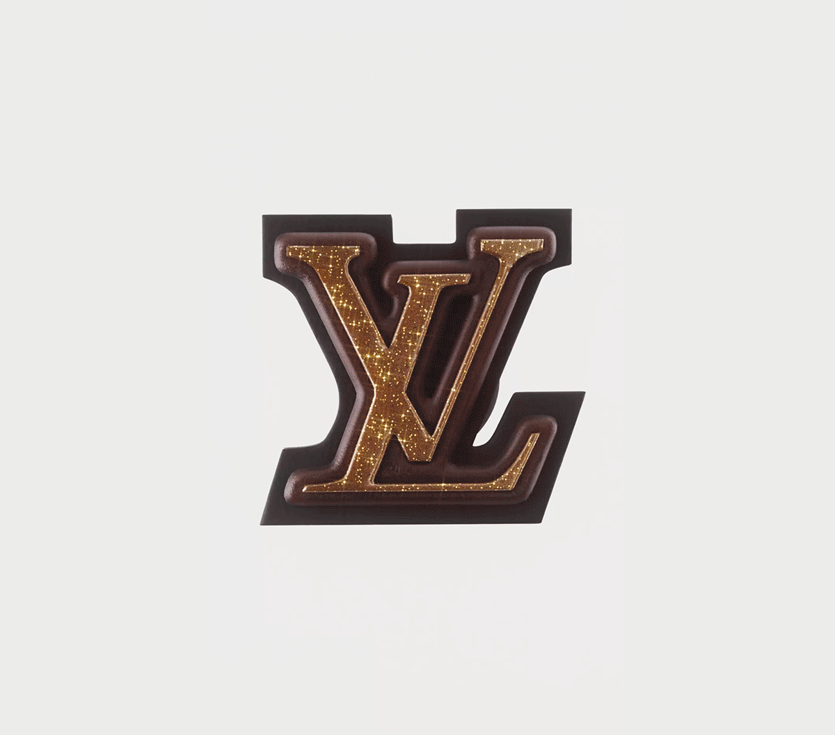 Close-up of a Louis Vuitton logo with gold glitter details and a black background.