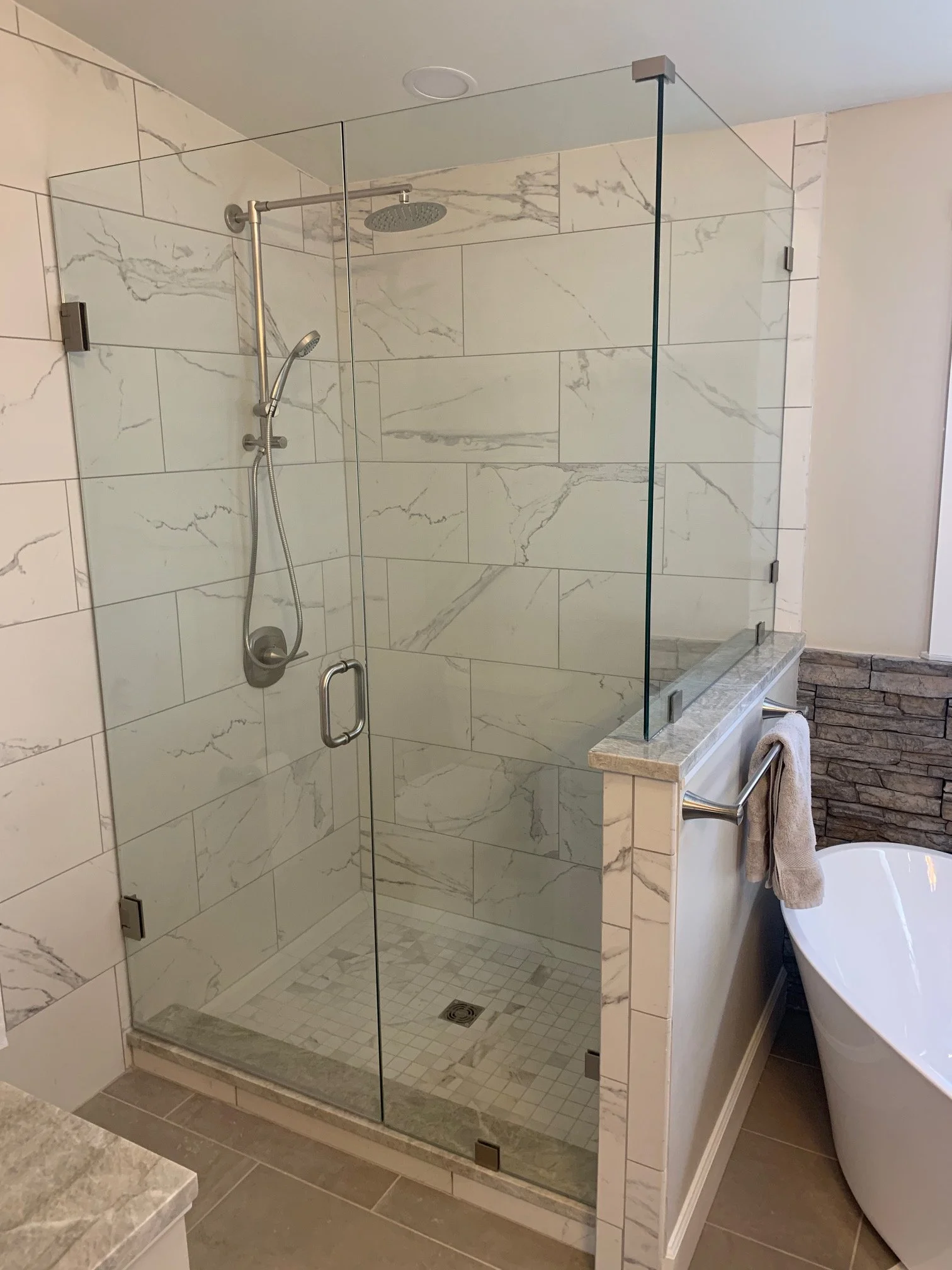Contemporary bathroom with custom glass shower enclosure
