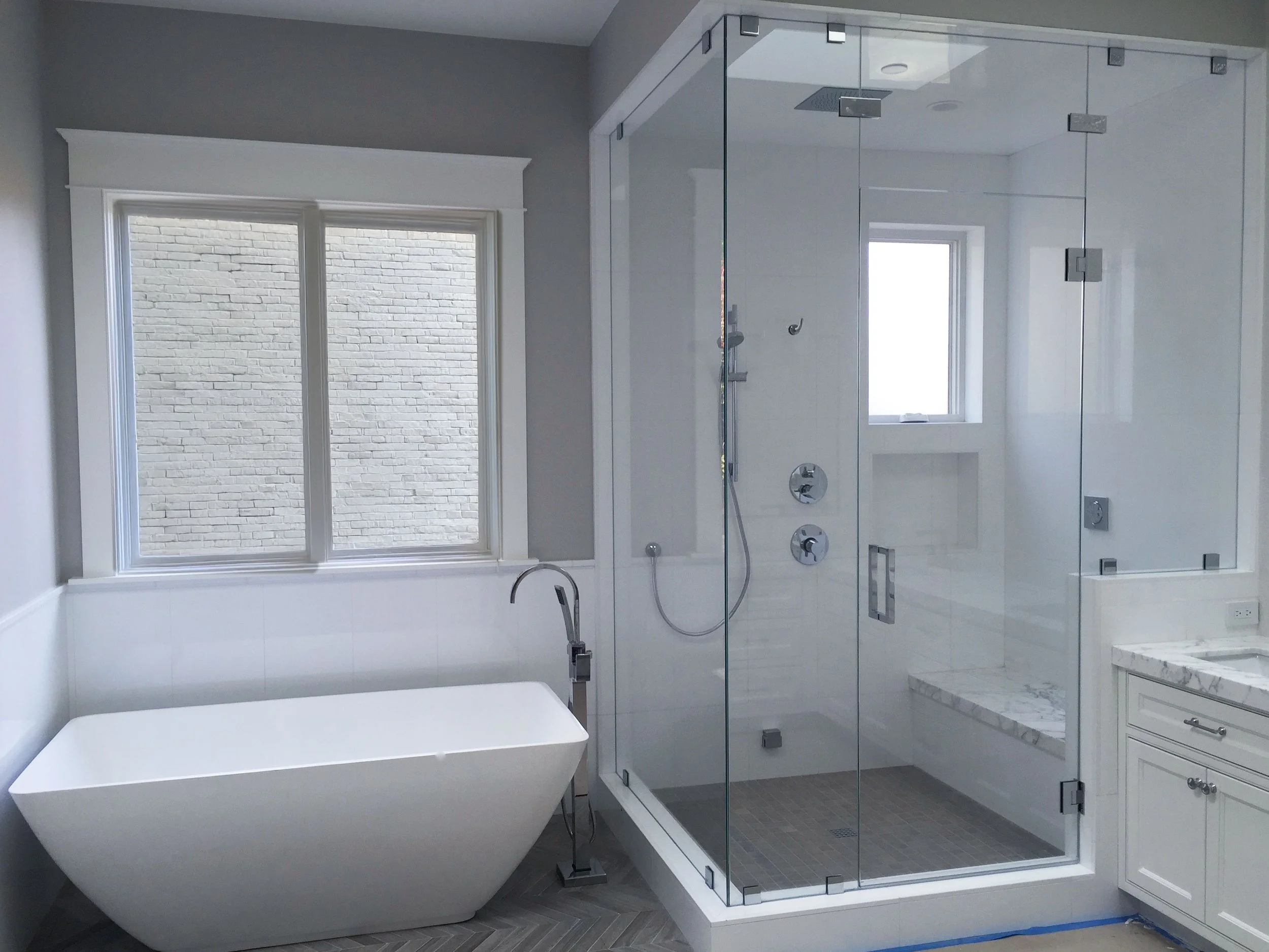 Custom bathroom featuring frameless glass shower doors