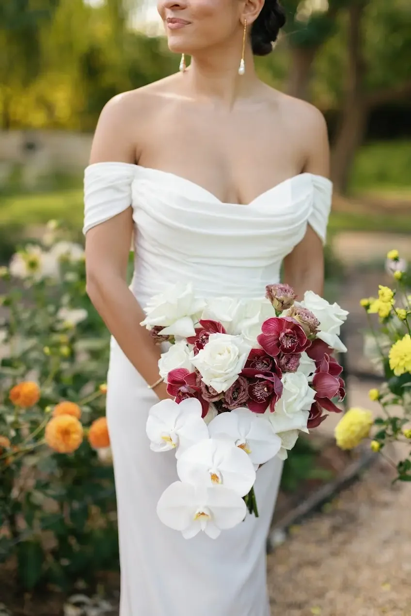 Bridal-bouquet-autumn-orchids-roses.webp