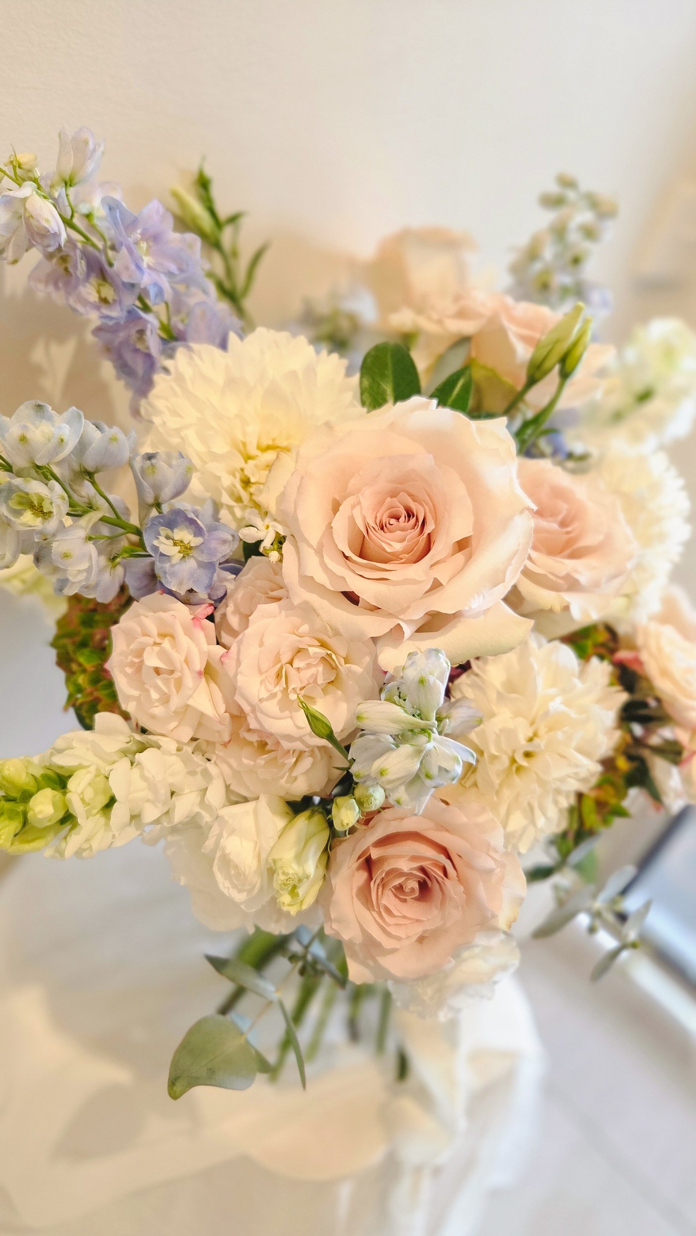 garden style bouquet with roses, delphinium, hydrangea, dahlias