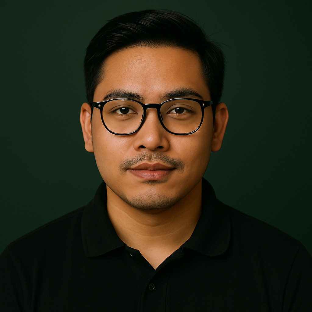 A young man with black hair, wearing glasses and a black collared shirt, looking at the camera with a neutral expression against a dark green background.
