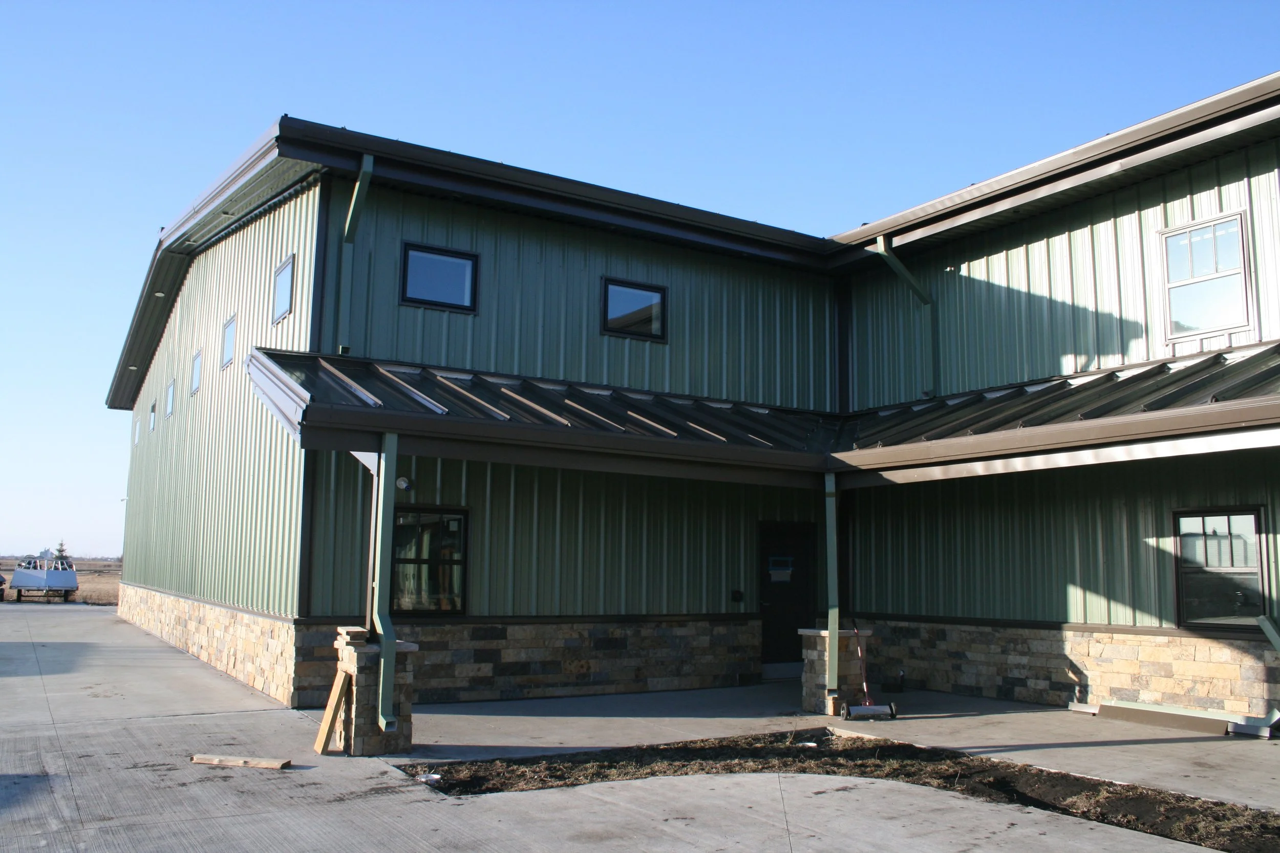 Two-story Barndominium or Shouse Beautiul Building with an indoor basketball court and tons of living and storage space.