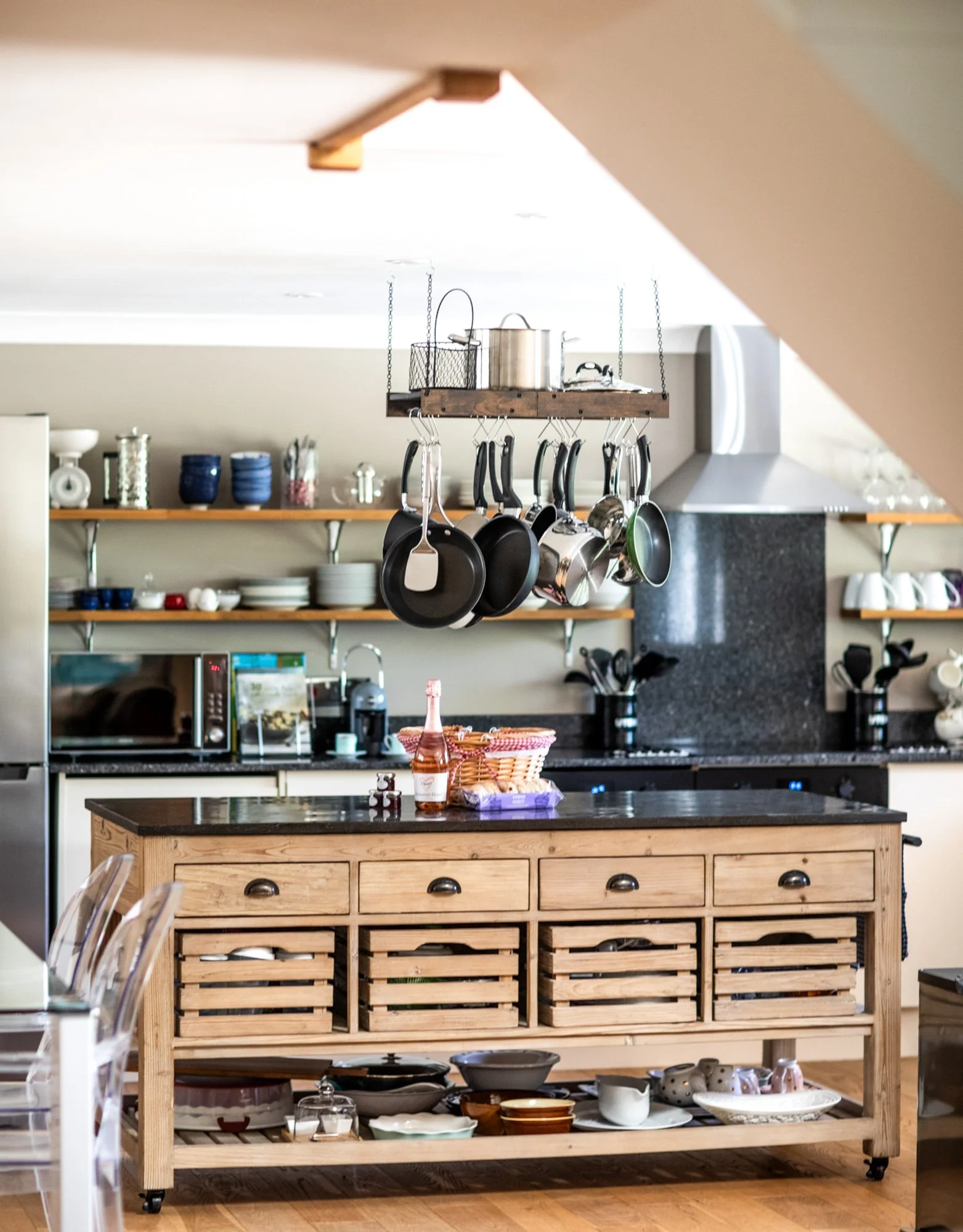 Open plan kitchen and kitchen island in a converted barn in Kent