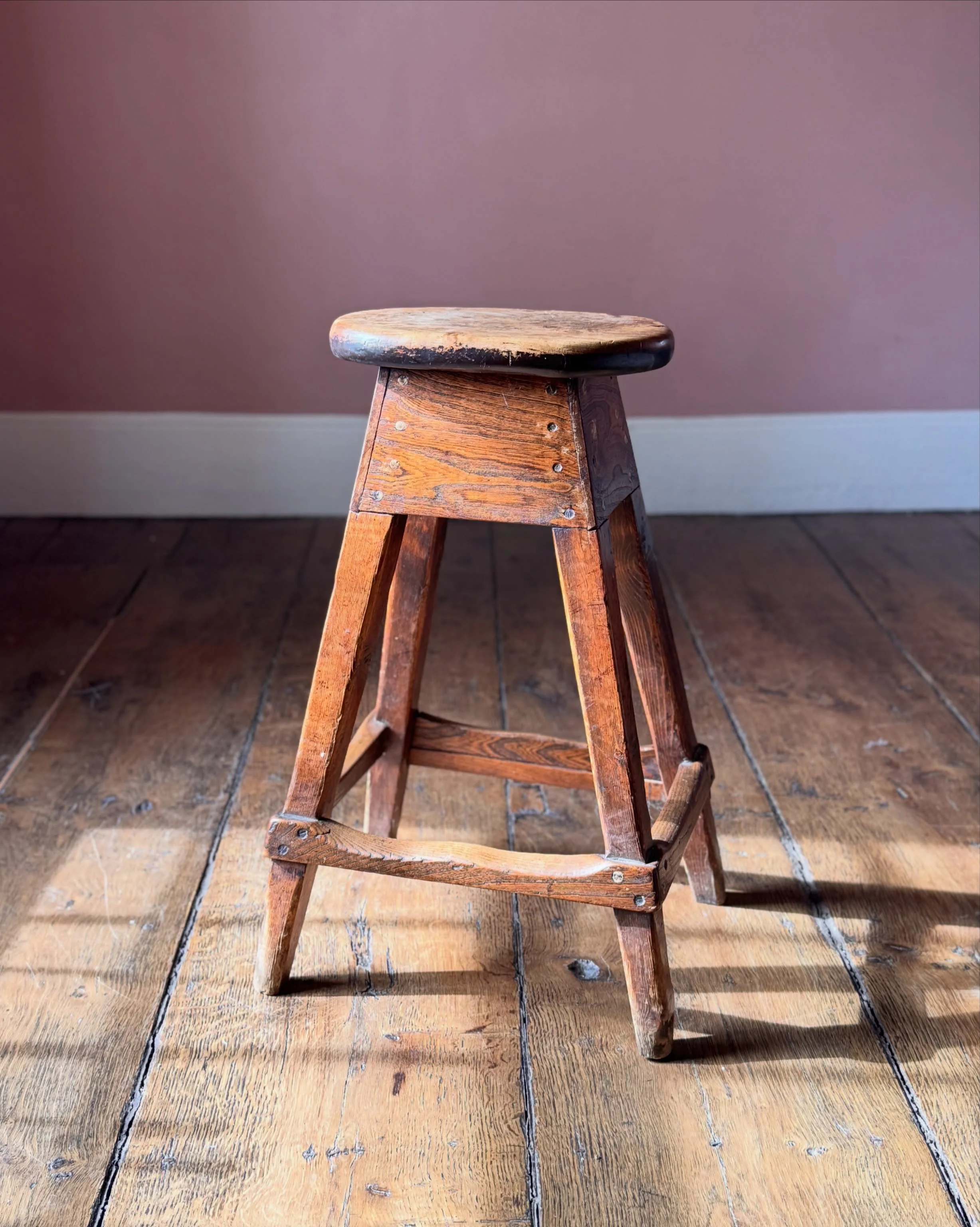 An attractive tall 19th Century elm stool. In great condition with a satisfying colour and shape. A great height and would be useful as a kitchen or bar stool. 

Height 67 cm
Width 44 cm
Depth 34 cm

Now available to view on our website via recent ac