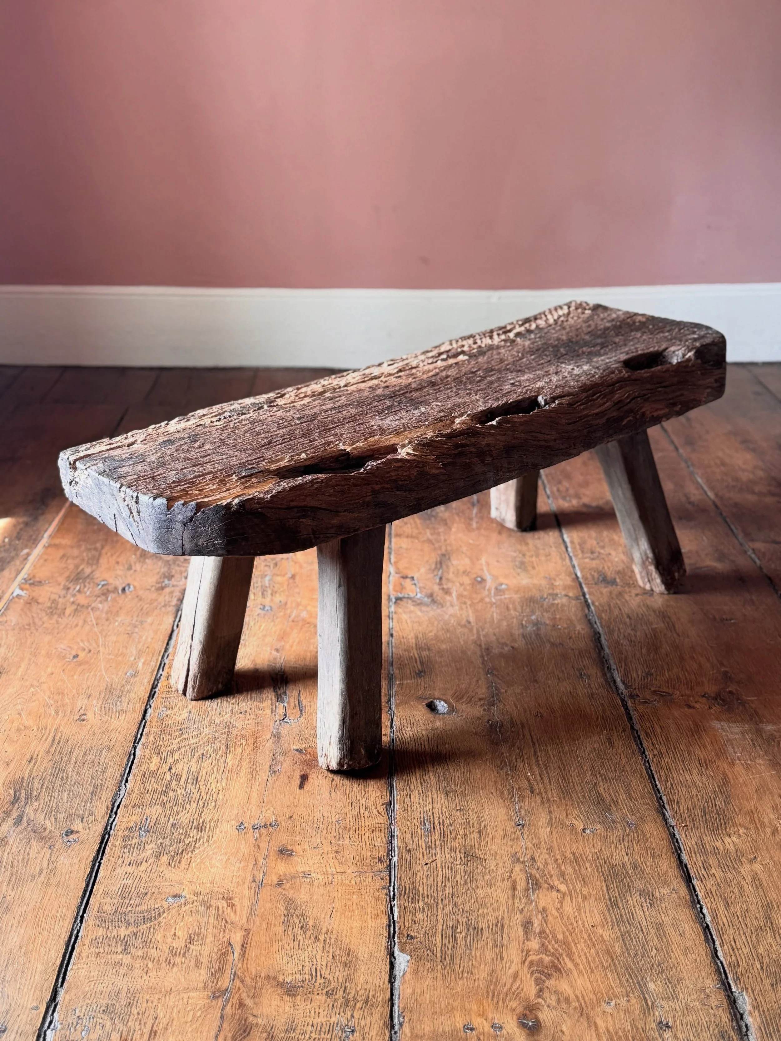 A characterful and evocative 19th Century oak pig bench. Sourced in Wales it has a wonderfully primitive top that had a previous life before being turned into a pig bench in the 1800s. A great piece of Welsh vernacular history. 

Height 41 cm
Width 1