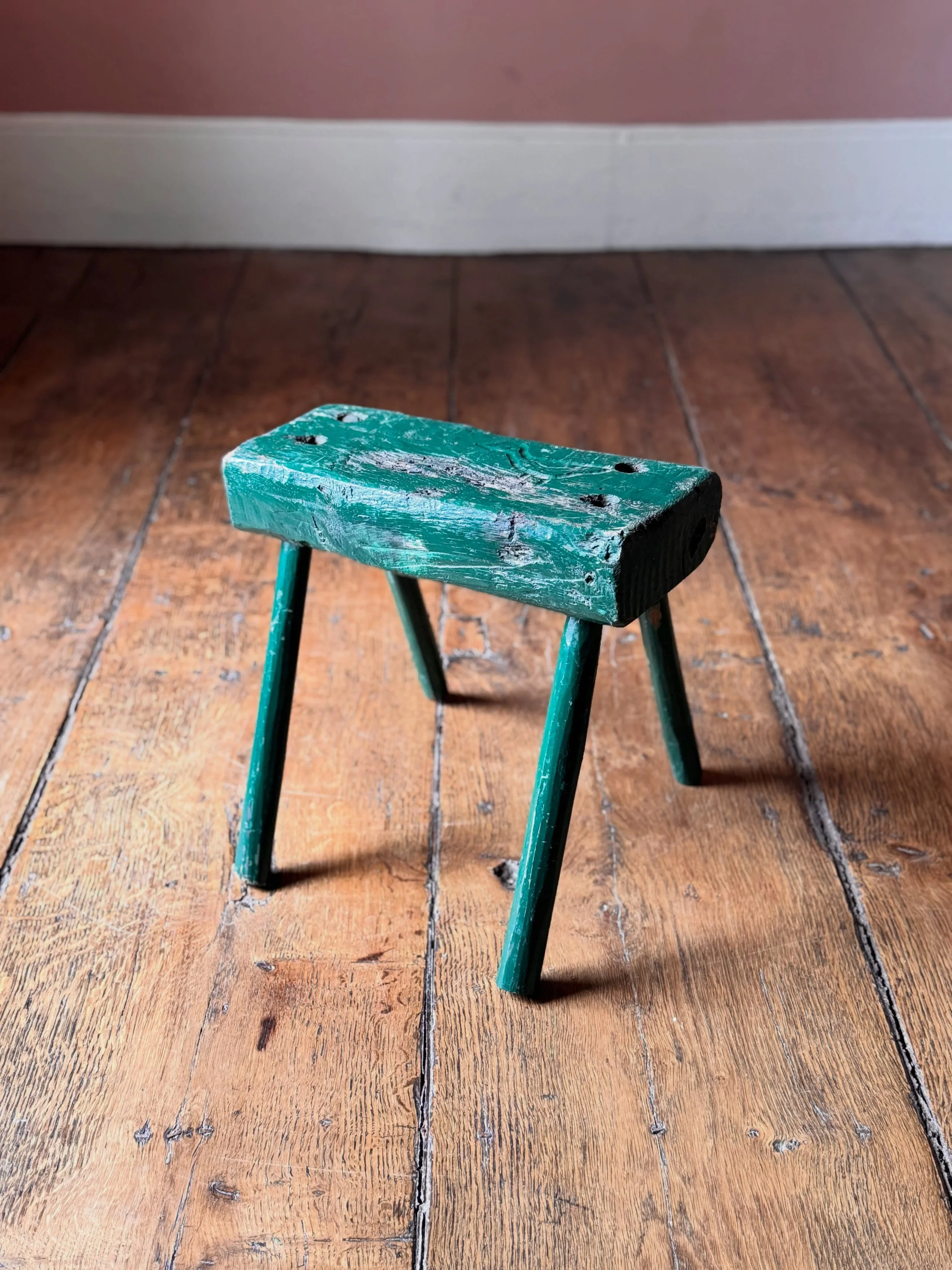 A wonderfully primitive 19th Century stool in its original green paint. This one is a bit special because someone has carved a naive folk art bird into the top; possibly a duck. Things like this really give an insight into an objects life and previou