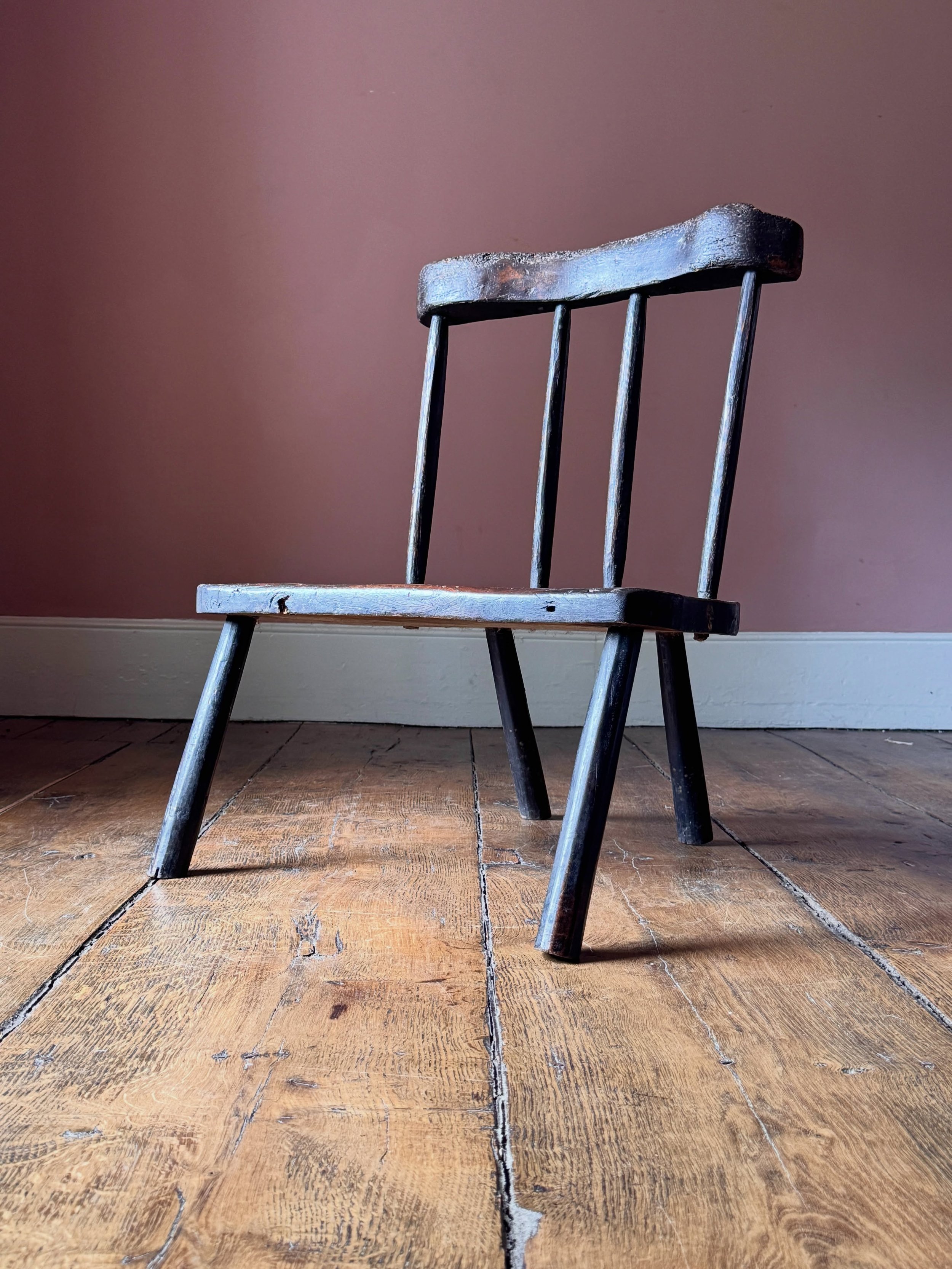 An unusual and very primitive 19th Century stick chair, likely estate or farm made from pieces of older timber. In the original black paint. An atmospheric and folky piece of vernacular furniture. 

Height 77 cm
Width 62 cm
Depth 62 cm

Now available