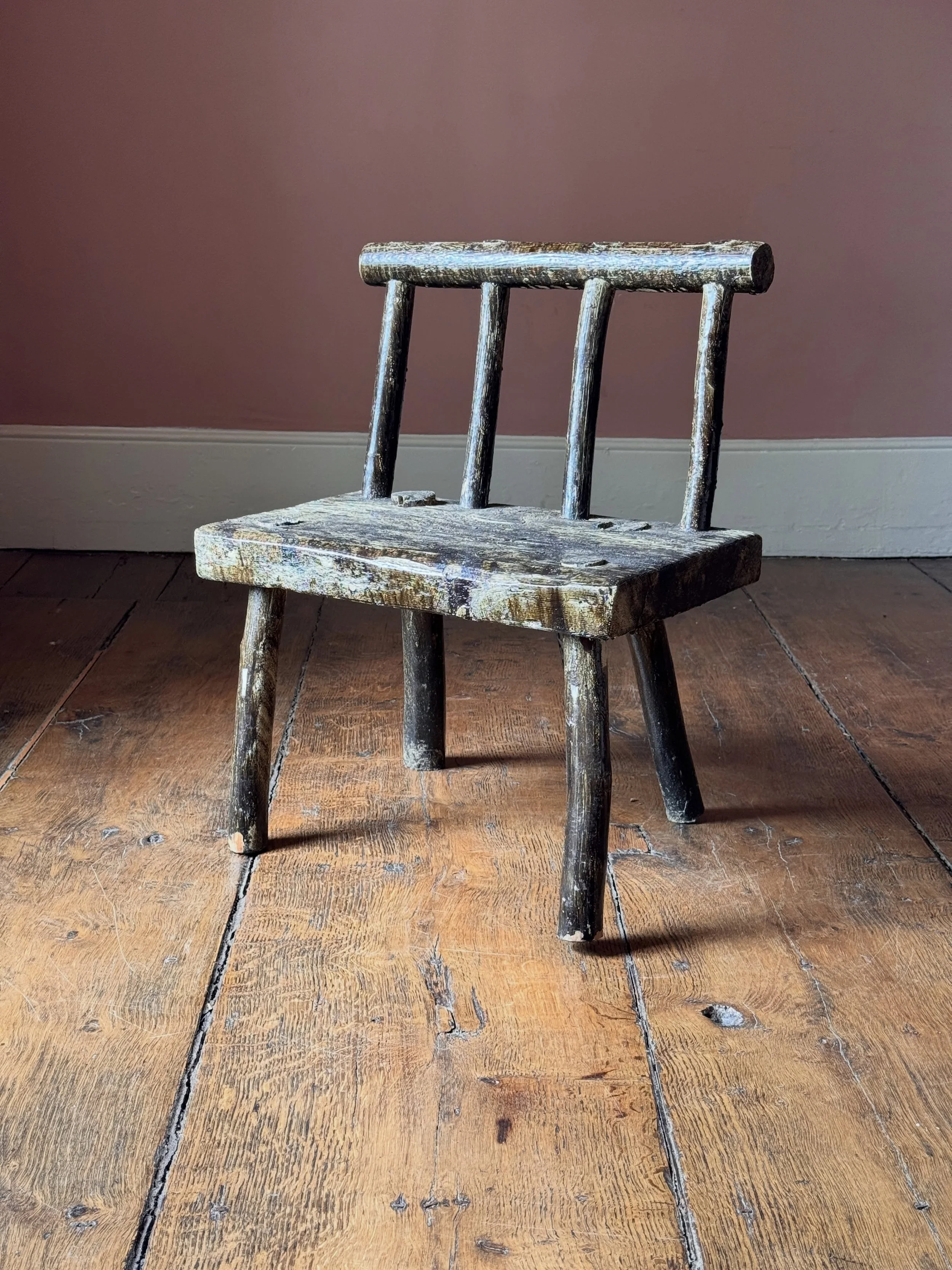 A primitive Irish hedge chair showing several layers of historic paint. Probably early 20th Century but could be earlier. Great chunky shape and folky presence. Sourced in County Clare, Ireland.

Height 61 cm
Width 51 cm
Depth 36 cm

Now available to