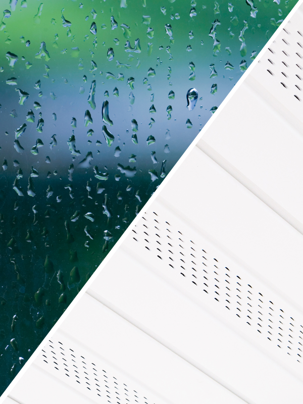 Close-up detail of rain droplets on clean window glazing paired with white vented soffit boards for roofline ventilation.
