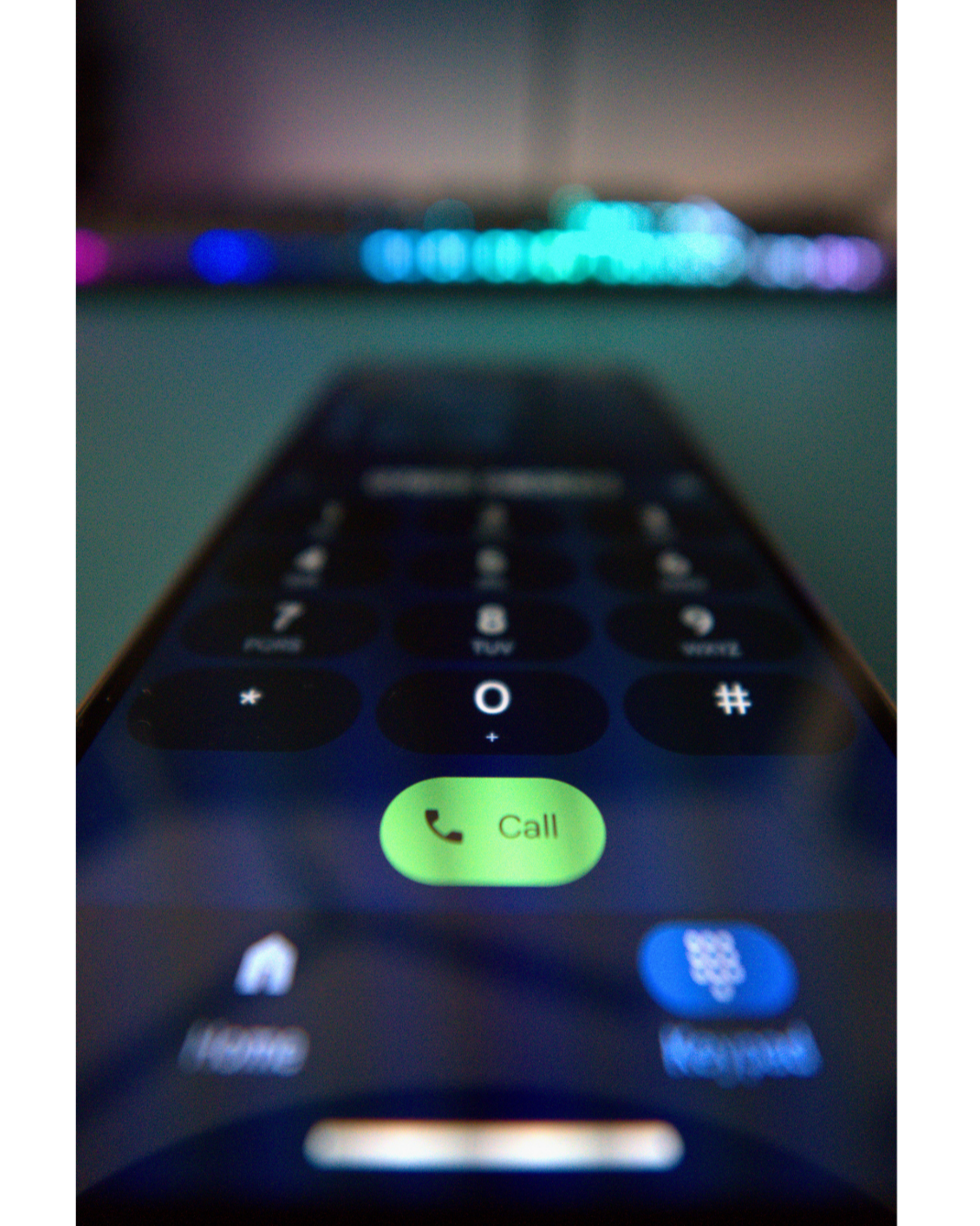 Mobile phone displaying contact number for professional videography services in Devon