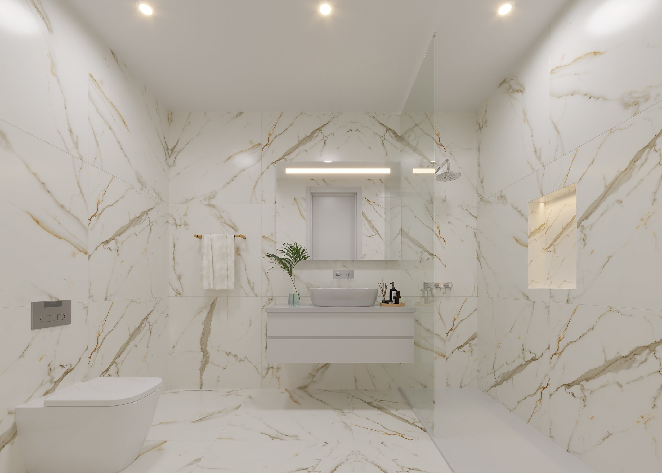 Banheiro moderno com paredes e chão de mármore branco com veios dourados, pia de vaso sob espelho com luz embutida, torneira moderna, toalheiro com toalha, plantas decorativas e ducha com vidro separado.