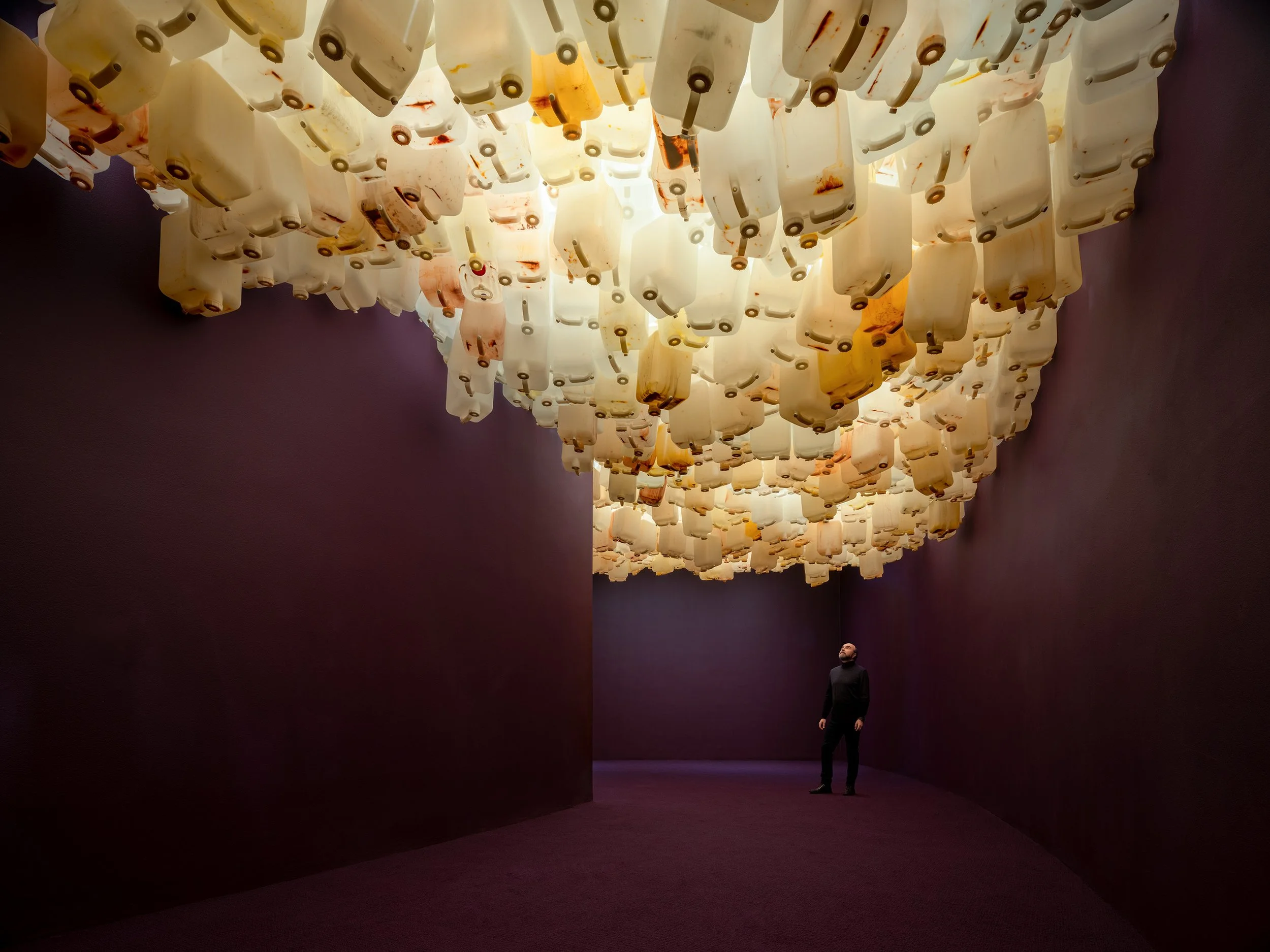 Photographer Ron Blunt viewing the installation, "John Akomfrah:  Purple" / Hirshhorn Museum and Sculpture Garden, Washington, DC