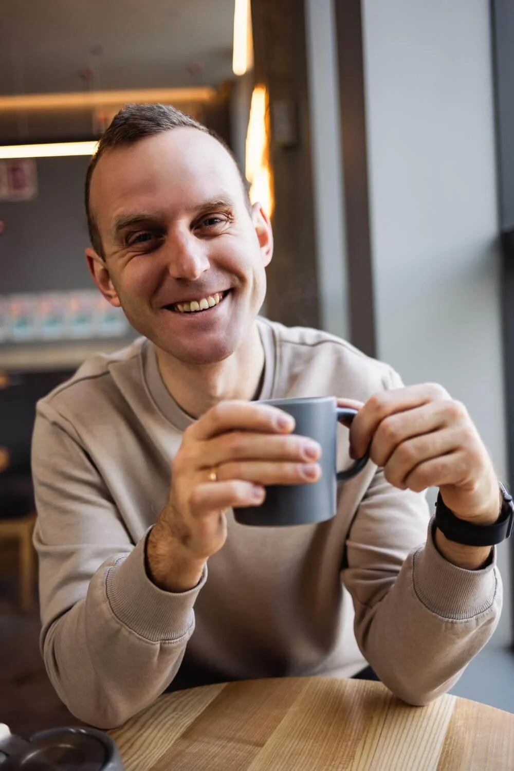 Man with in coffee shop  holding mug during after a brainspotting session