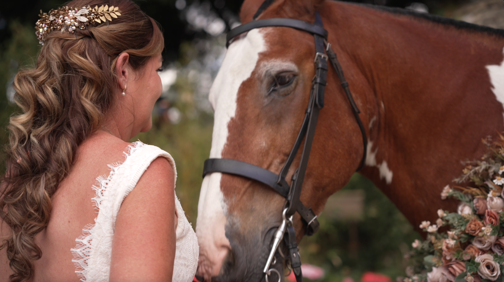Bride Louise with her horse at her Stonehouse Court Hotel wedding