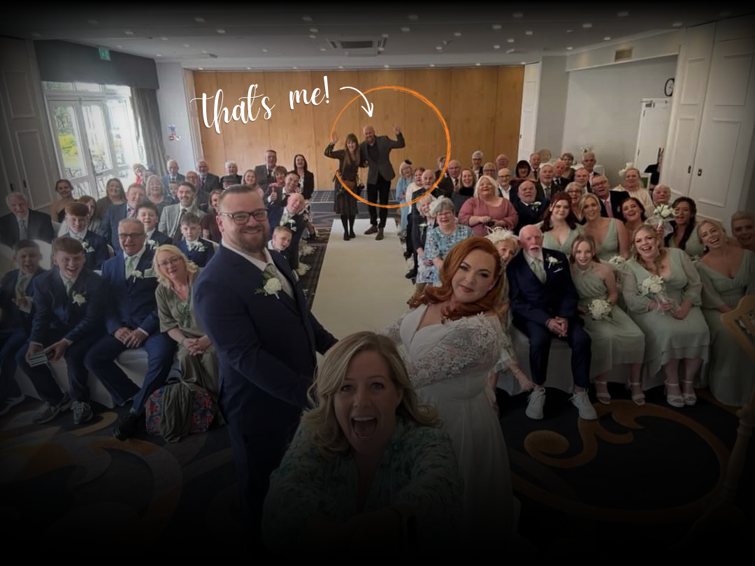 Wedding videographer captured in selfie during a wedding ceremony