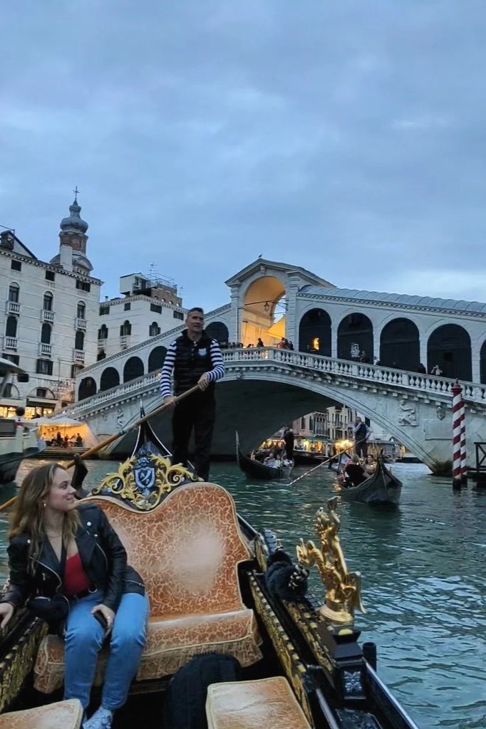 in the gondola at the Rialto Bridge