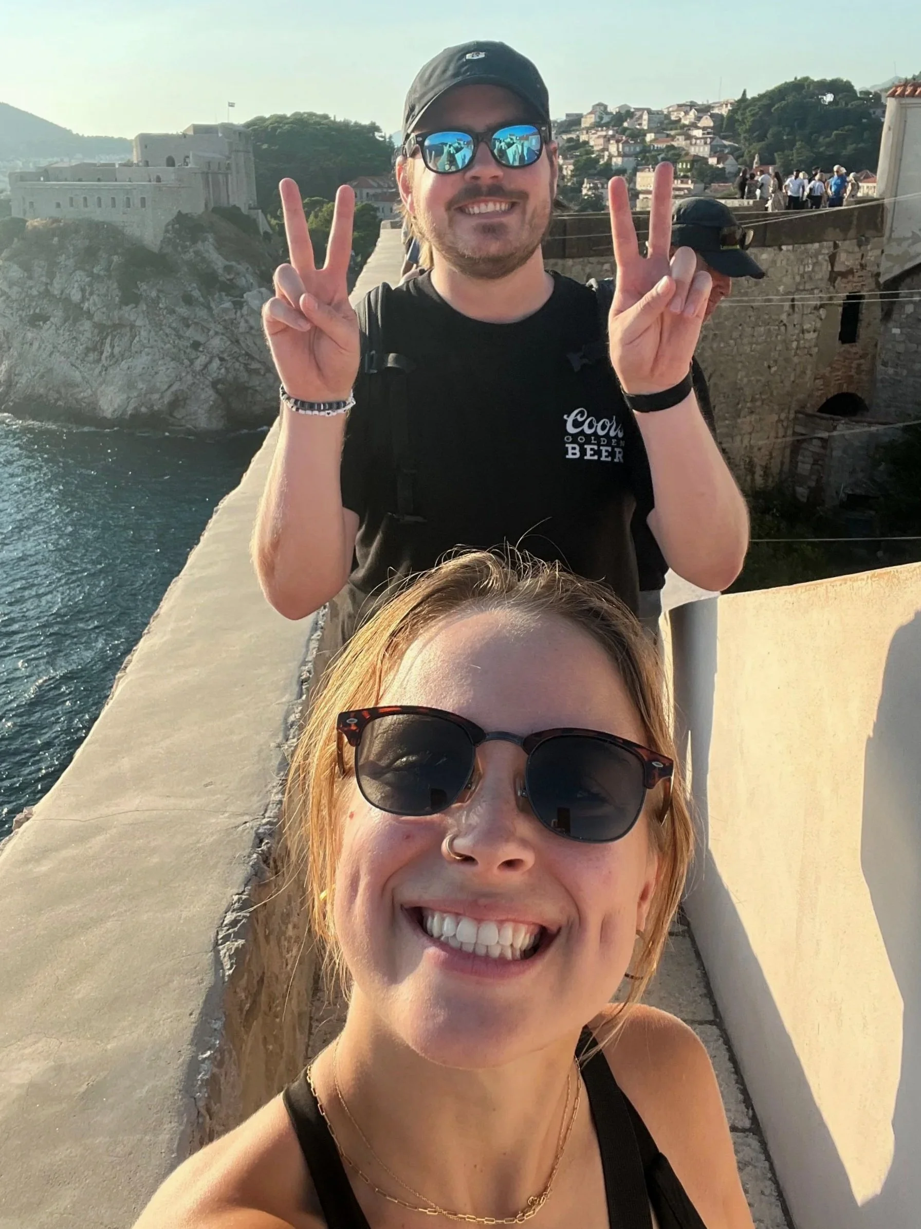 Tys and I walking the city walls with Fort Lovrijenac in the background