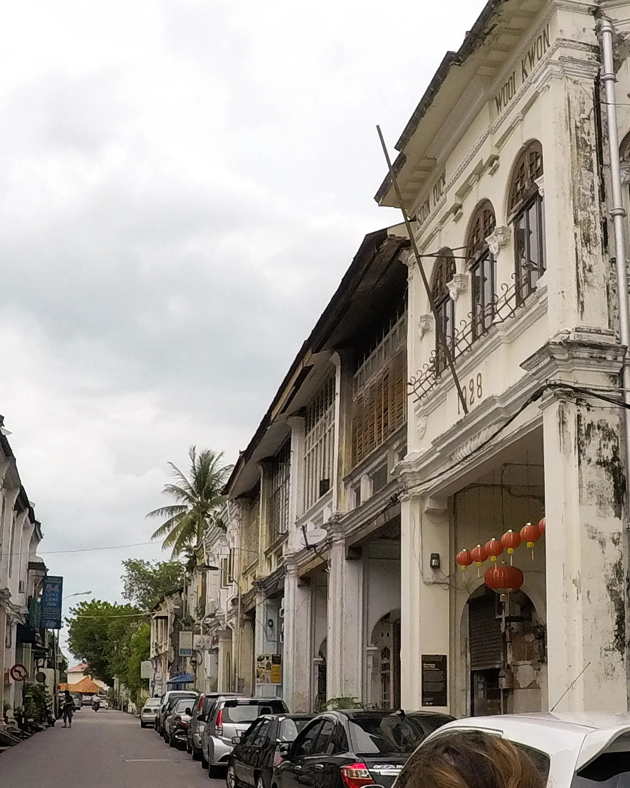 Love Lane lined with old colonial style houses with peeling facades.