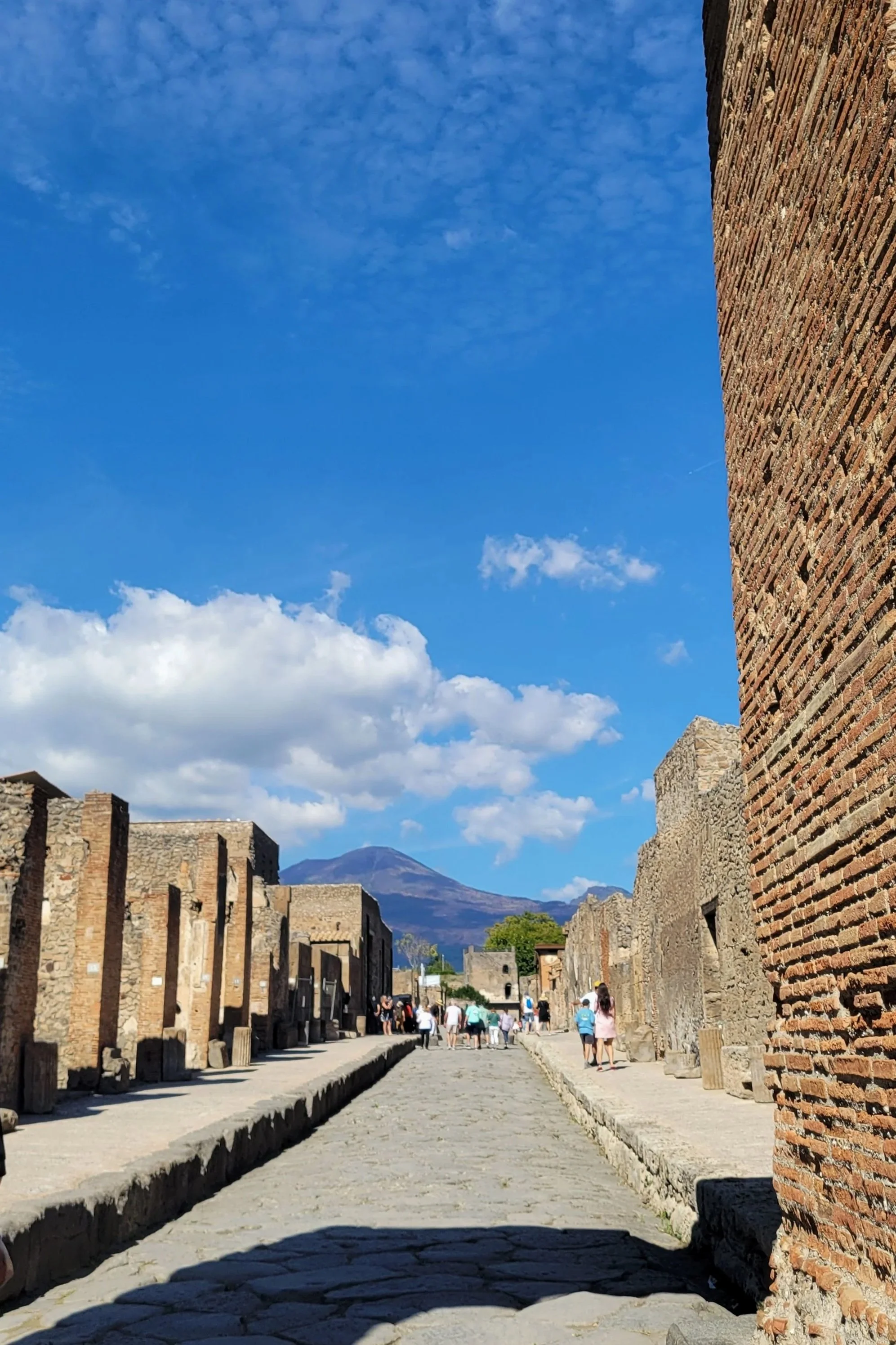 view of vesuvius in distance from the forum in pompeii
