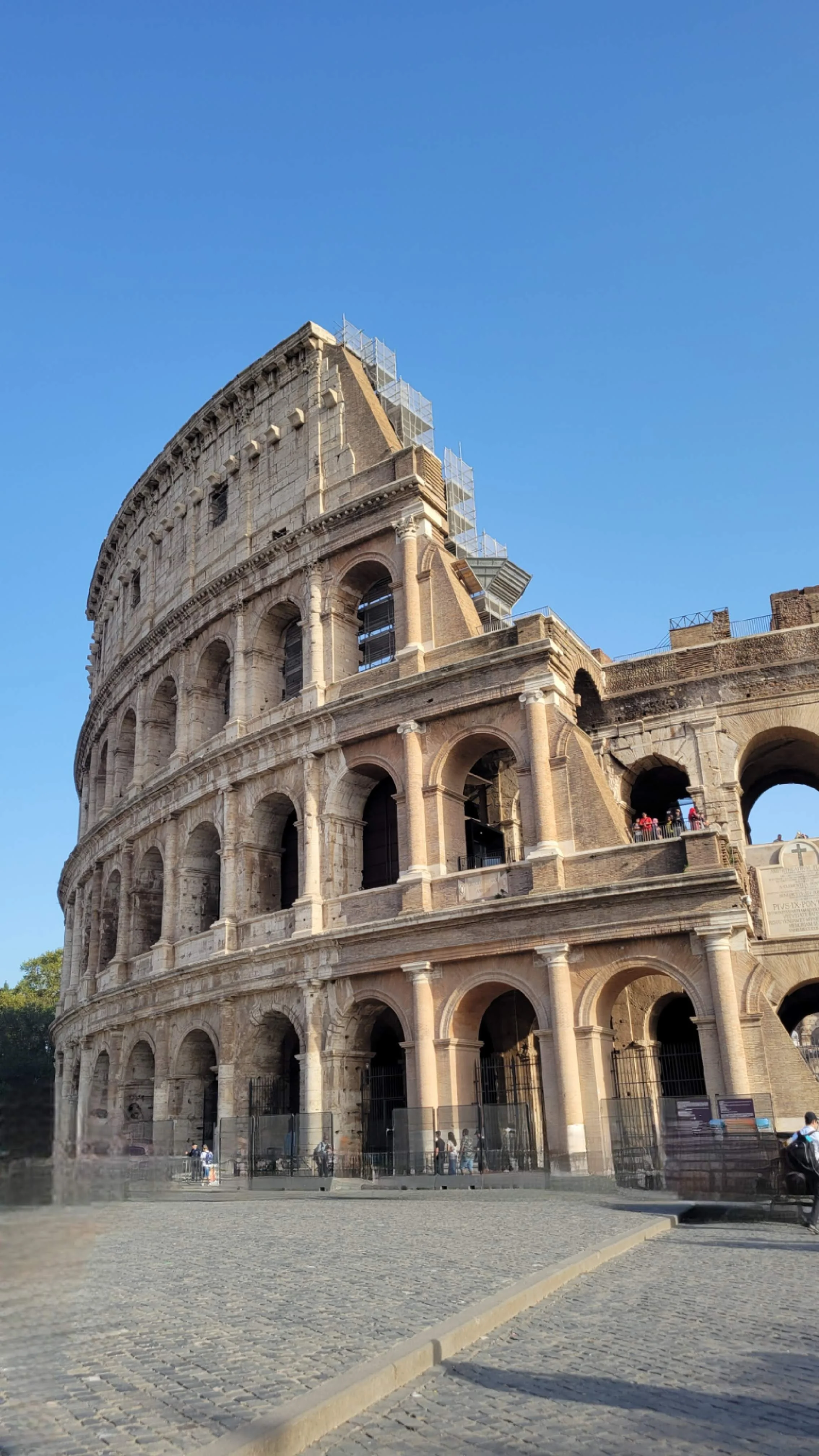 Exterior shot of the Colosseum in Rome, Italy. The image is of the highest parts of the walls that remain today.