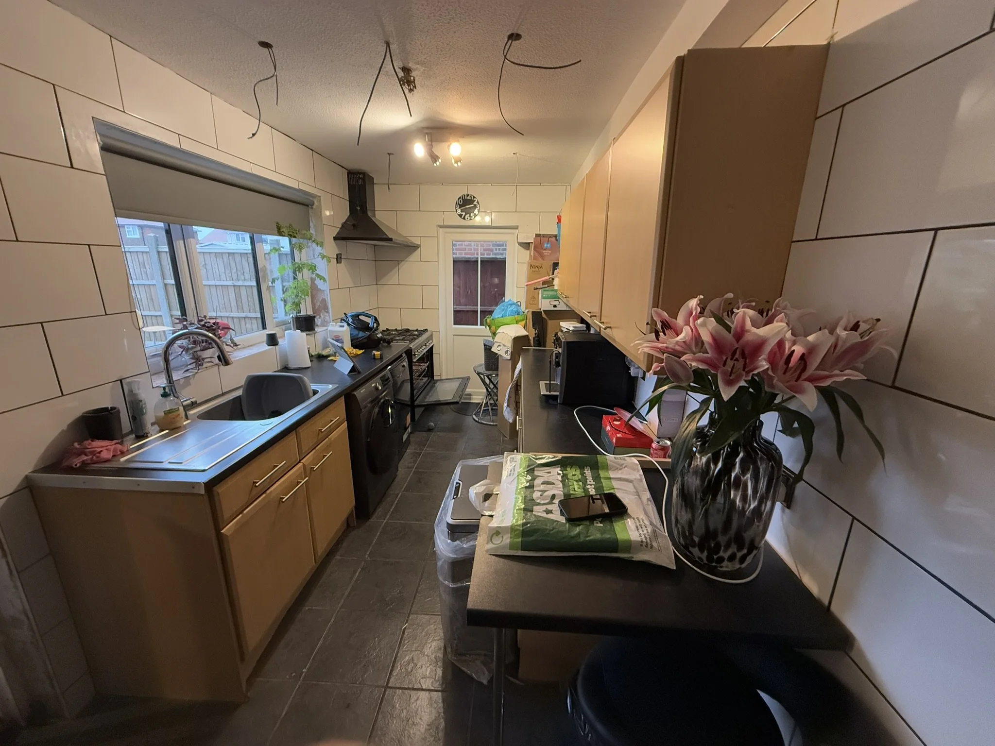 The original kitchen featured dated wooden cabinetry