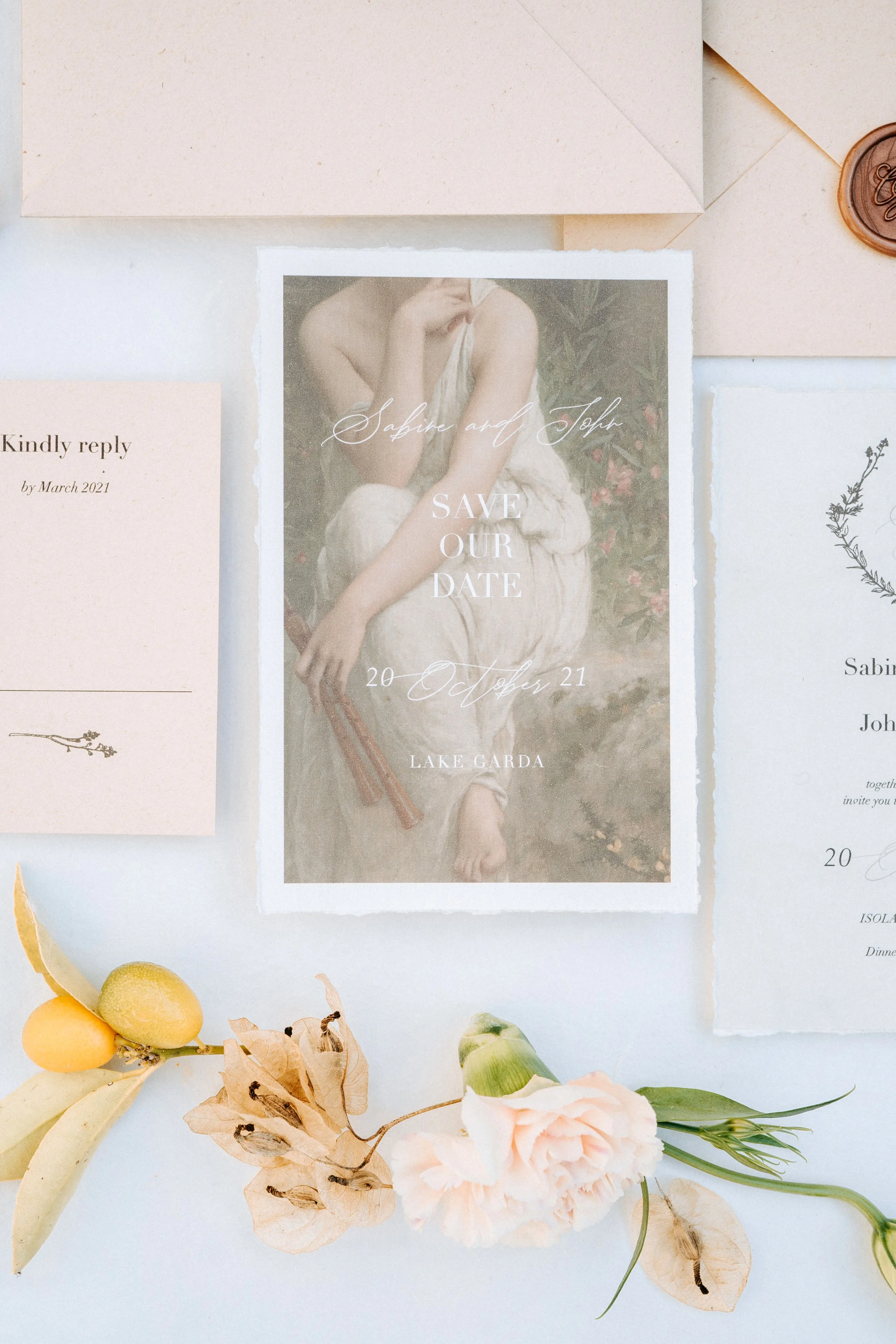 A wedding save-the-date card with a classic art style portrait of a woman, surrounded by flowers and wedding invitations.