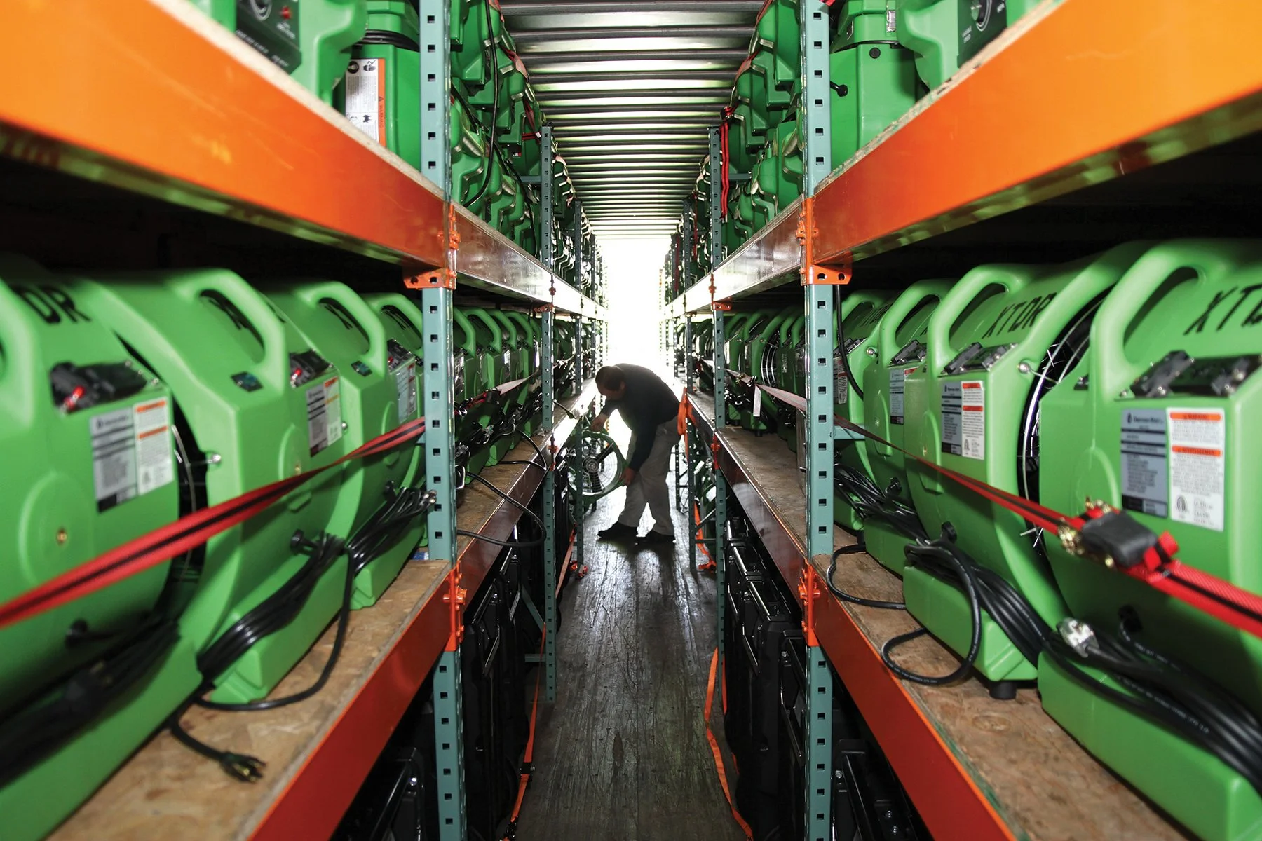 A SERVPRO Team Member keeping the high-velocity air movers organized and ready for any sized disaster.