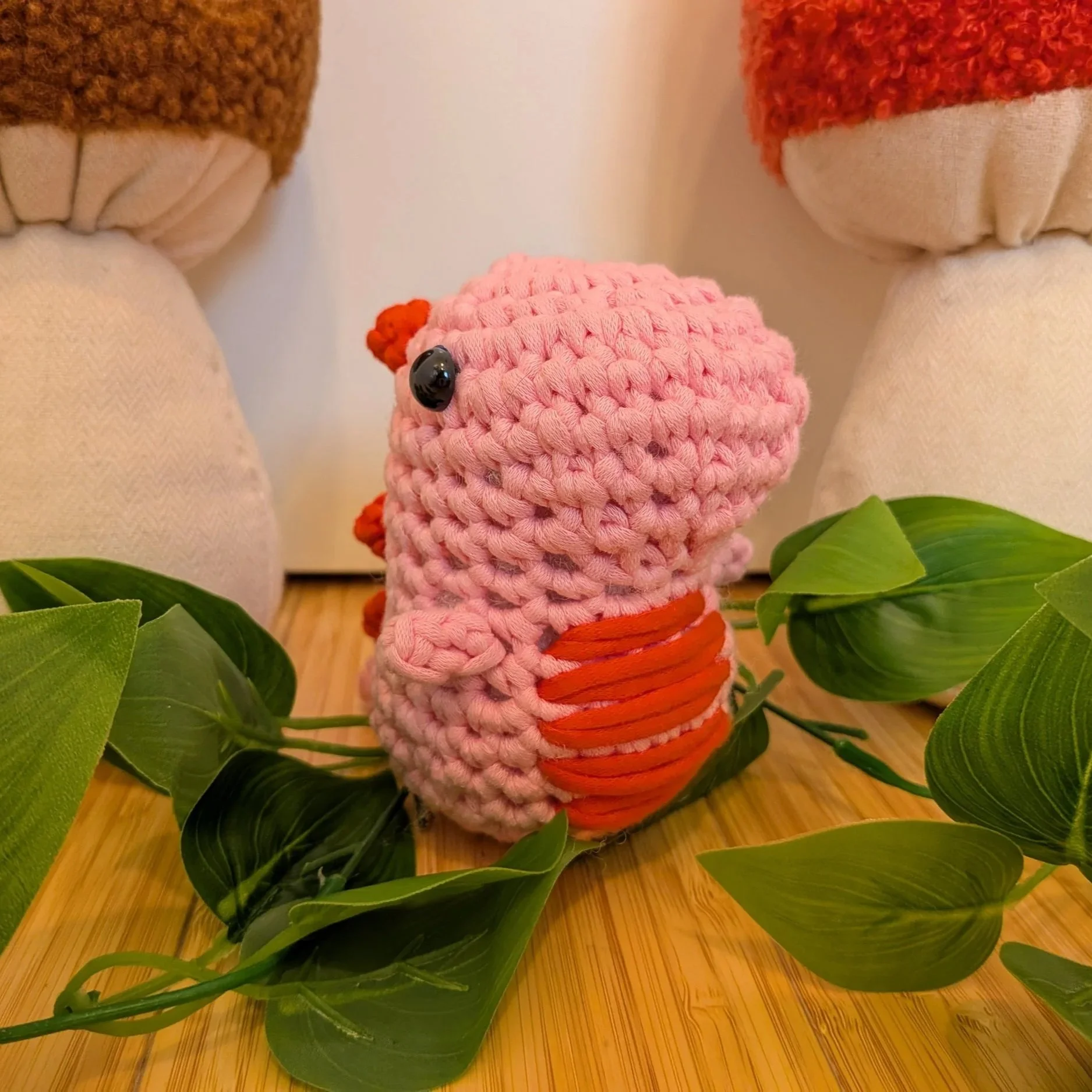 pink dino crocheted stuffy