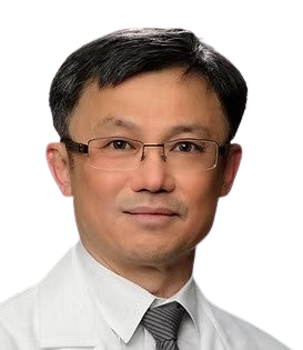 Headshot of a man with short black hair, wearing glasses, a white collared shirt, and a gray tie, against a gray gradient background.