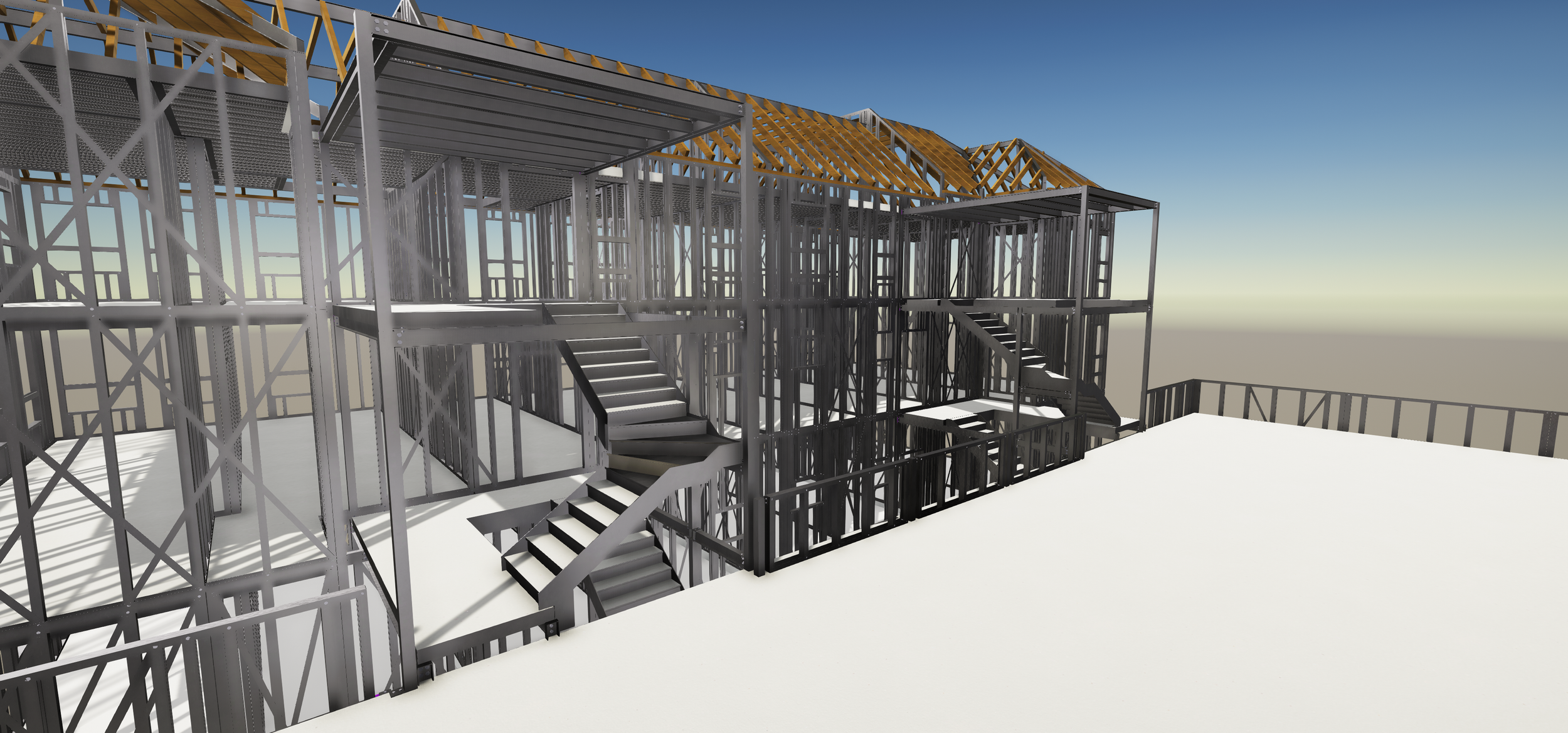 Sky view of a building under construction with metal framing and stairs, on a white surface.
