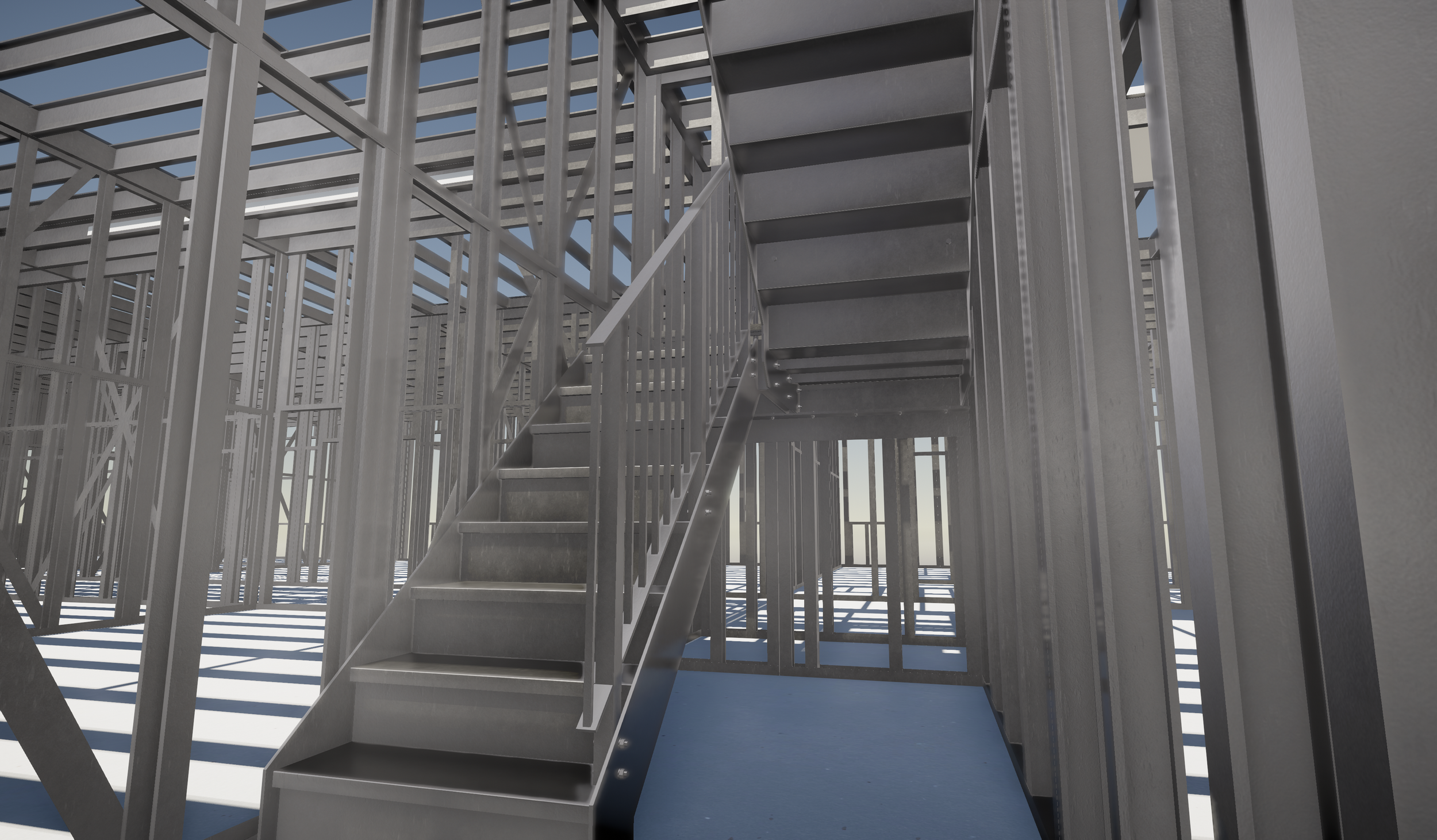 Metal staircase inside a building under construction with metal framing, no walls or roof yet.