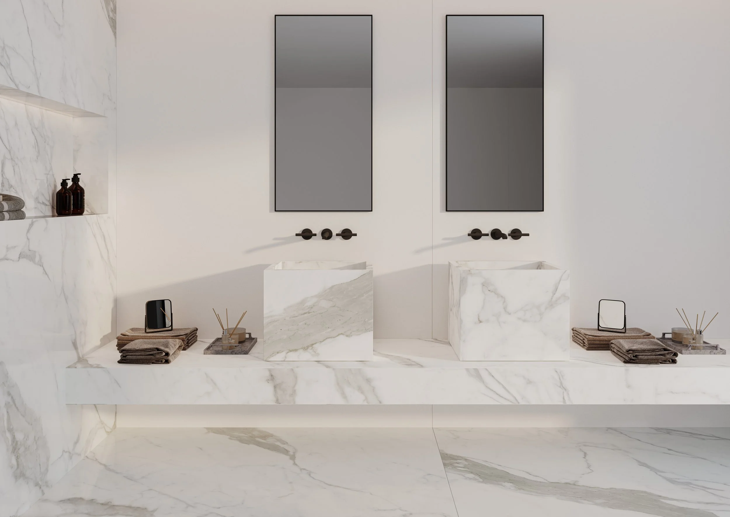 Modern bathroom with marble countertops, two rectangular mirrors, and double sinks, decorated with towels, small mirrors, and reed diffusers.