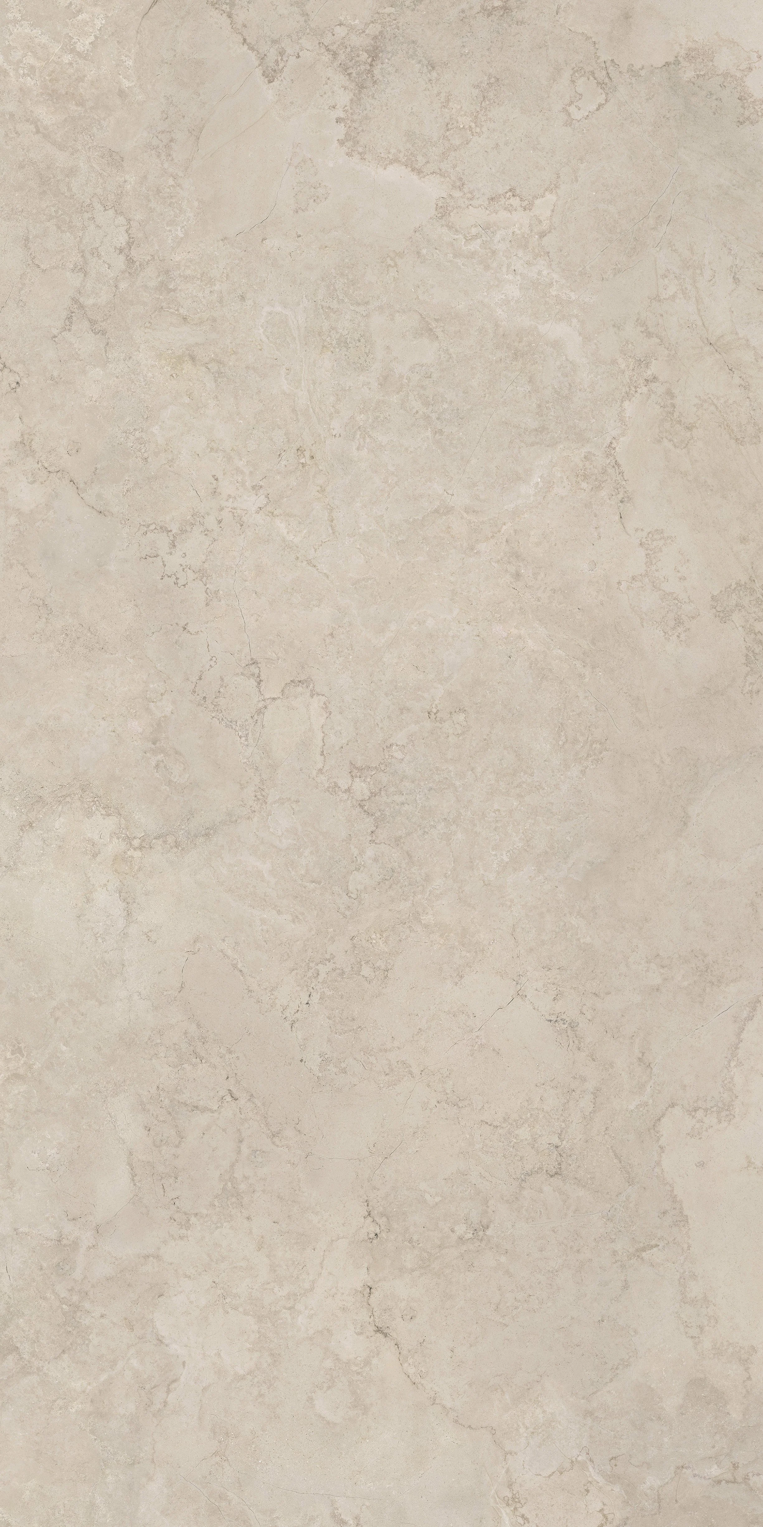 A beige stone or tile surface with natural veining and texture.