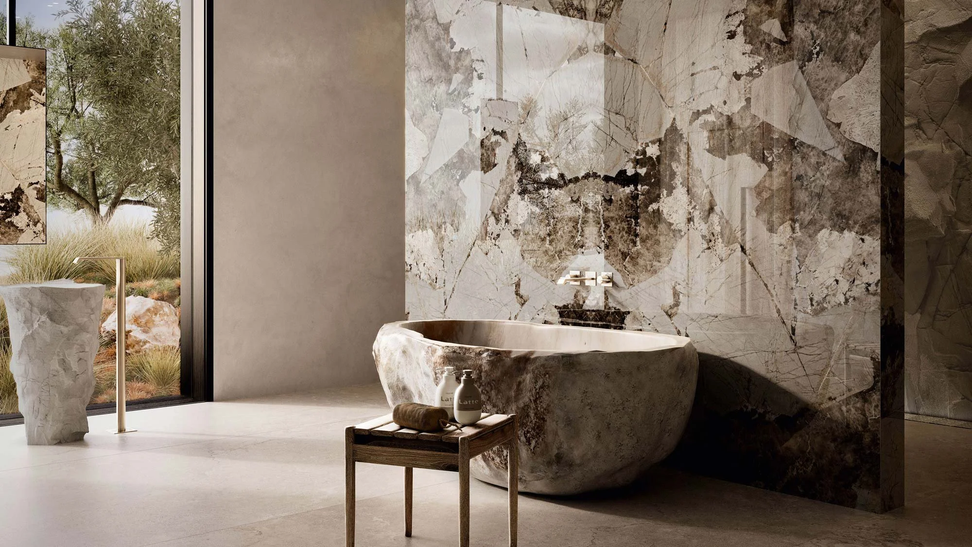 Modern bathroom with a free-standing marble bathtub, a small wooden stool with bath products, a textured wall with stone patterns, and a large window showing outdoor greenery.