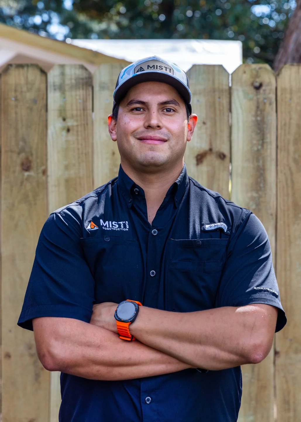 The owner of MISTI Roofing posing for his headshot