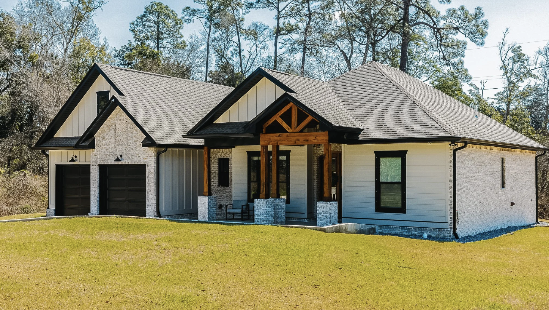 New construction home in Northwest Florida with architectural shingle roof and modern farmhouse design