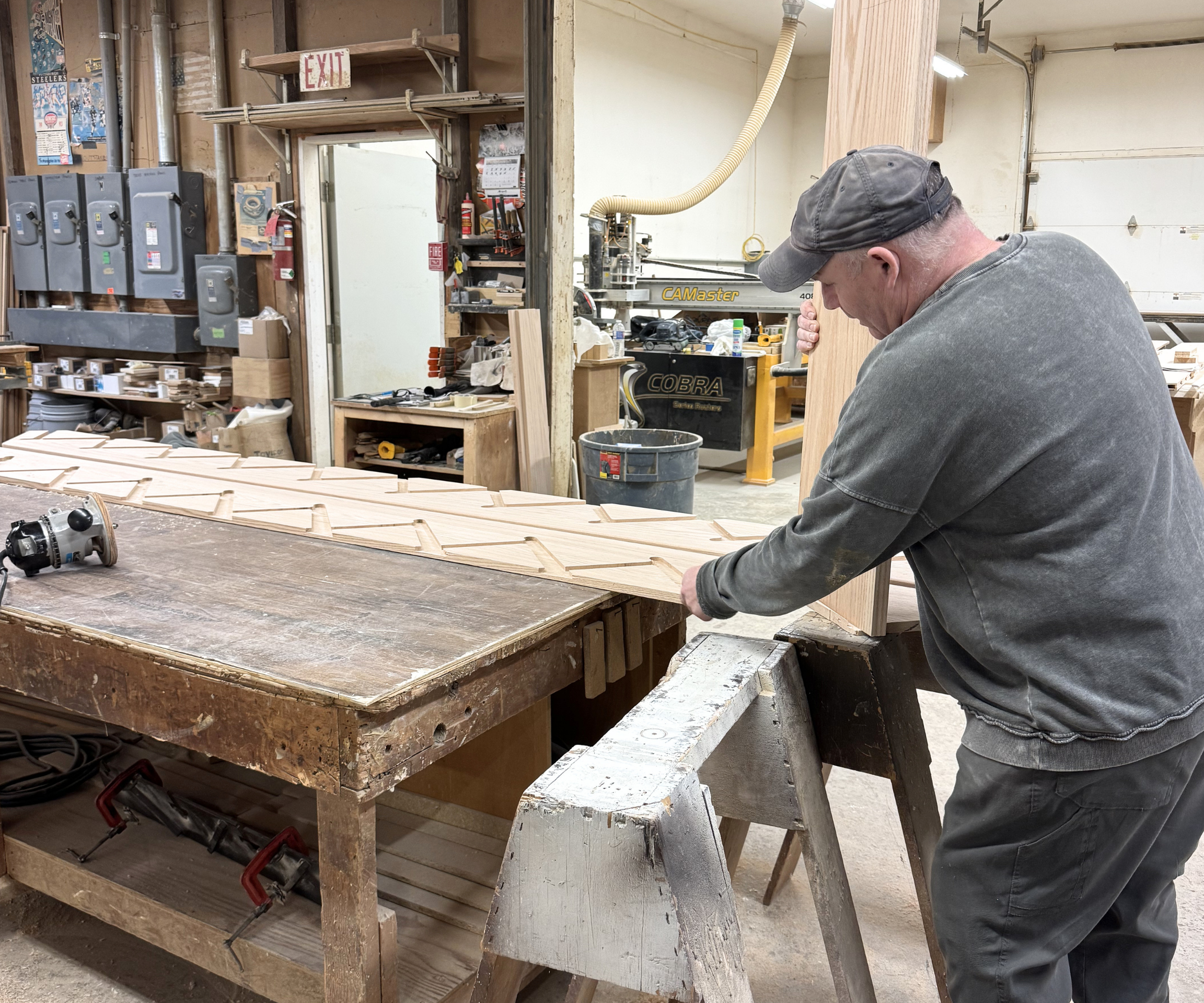 G2 employee working inside a factory making a stairway