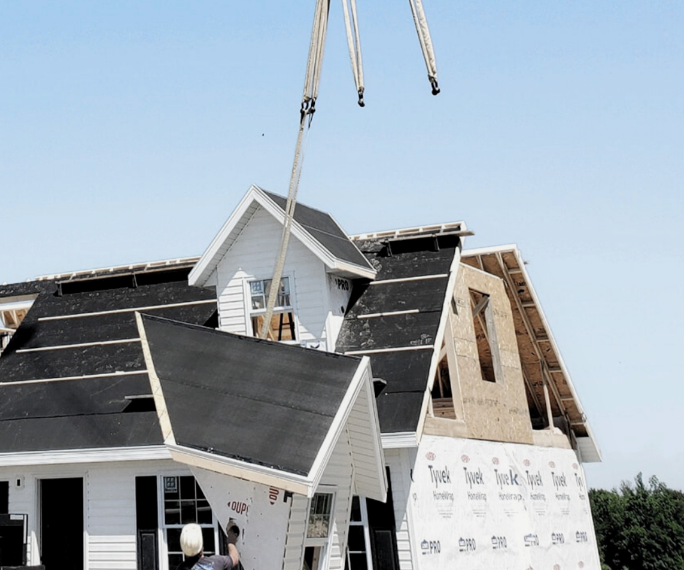 A white Lake City Homes modular home on set day