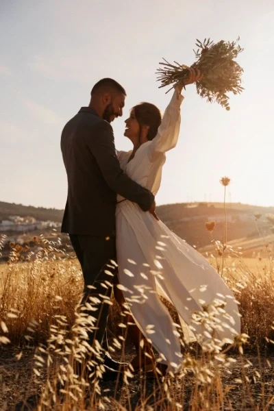Man and woman in field on wedding day
