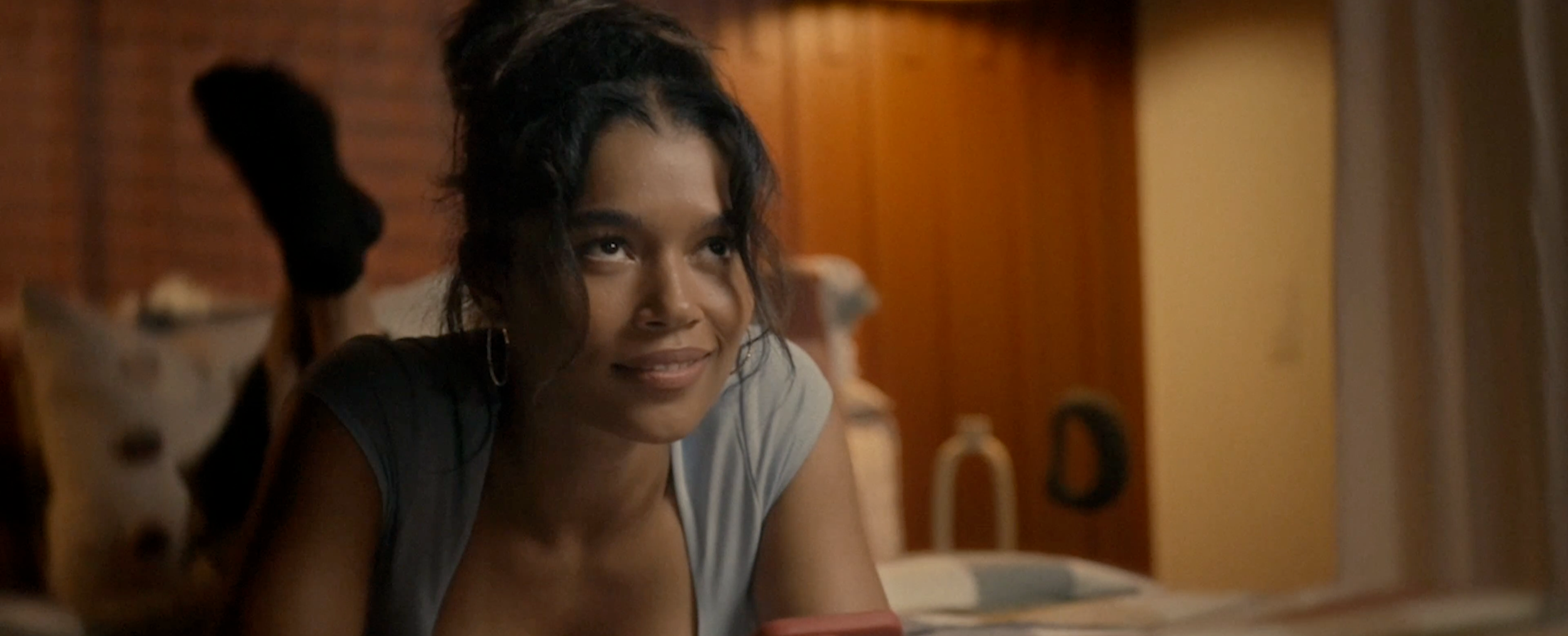 Savannah Bangoura in a warmly lit film still.