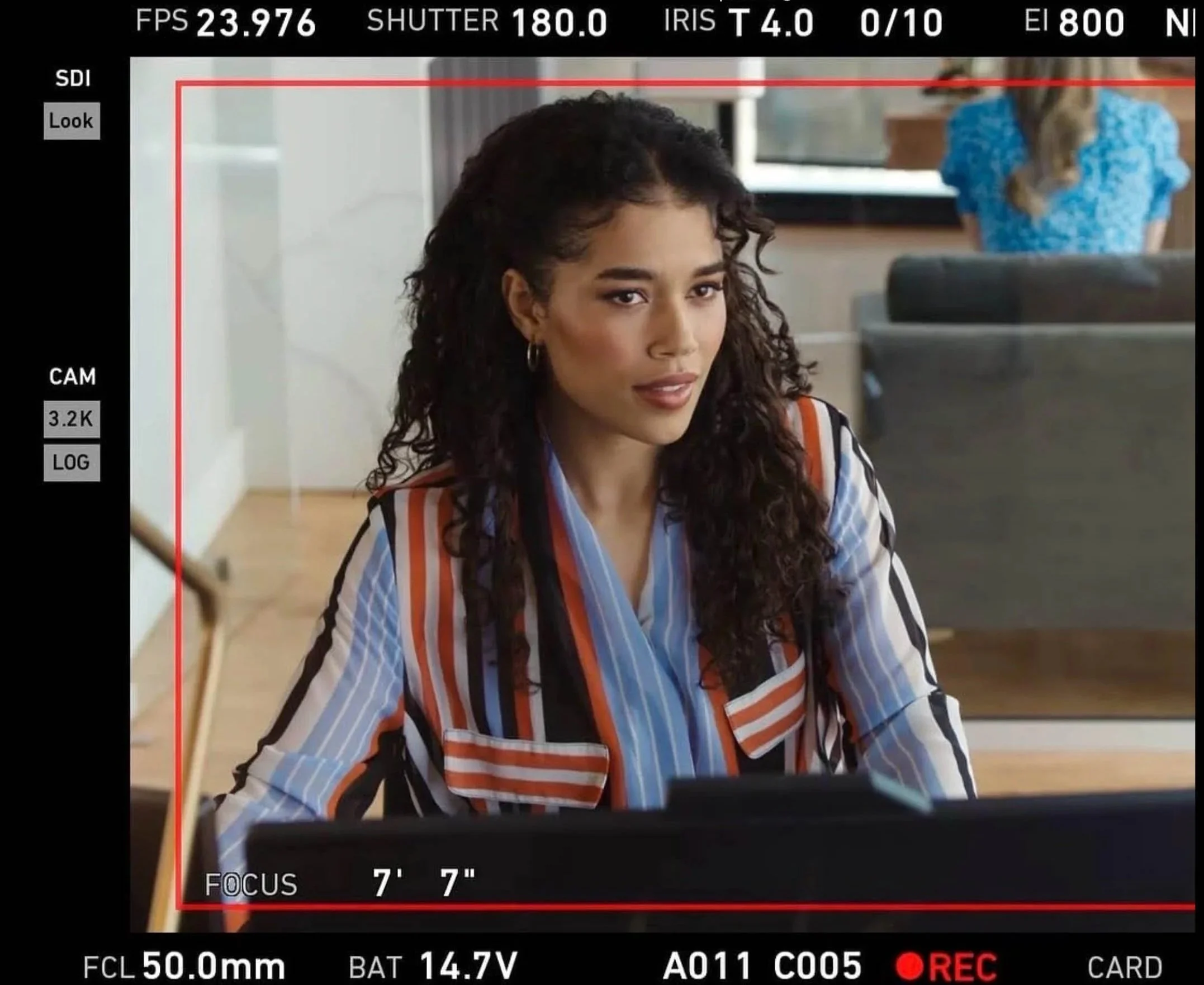 Actress Savannah Bangoura in a film scene viewed through a camera monitor.