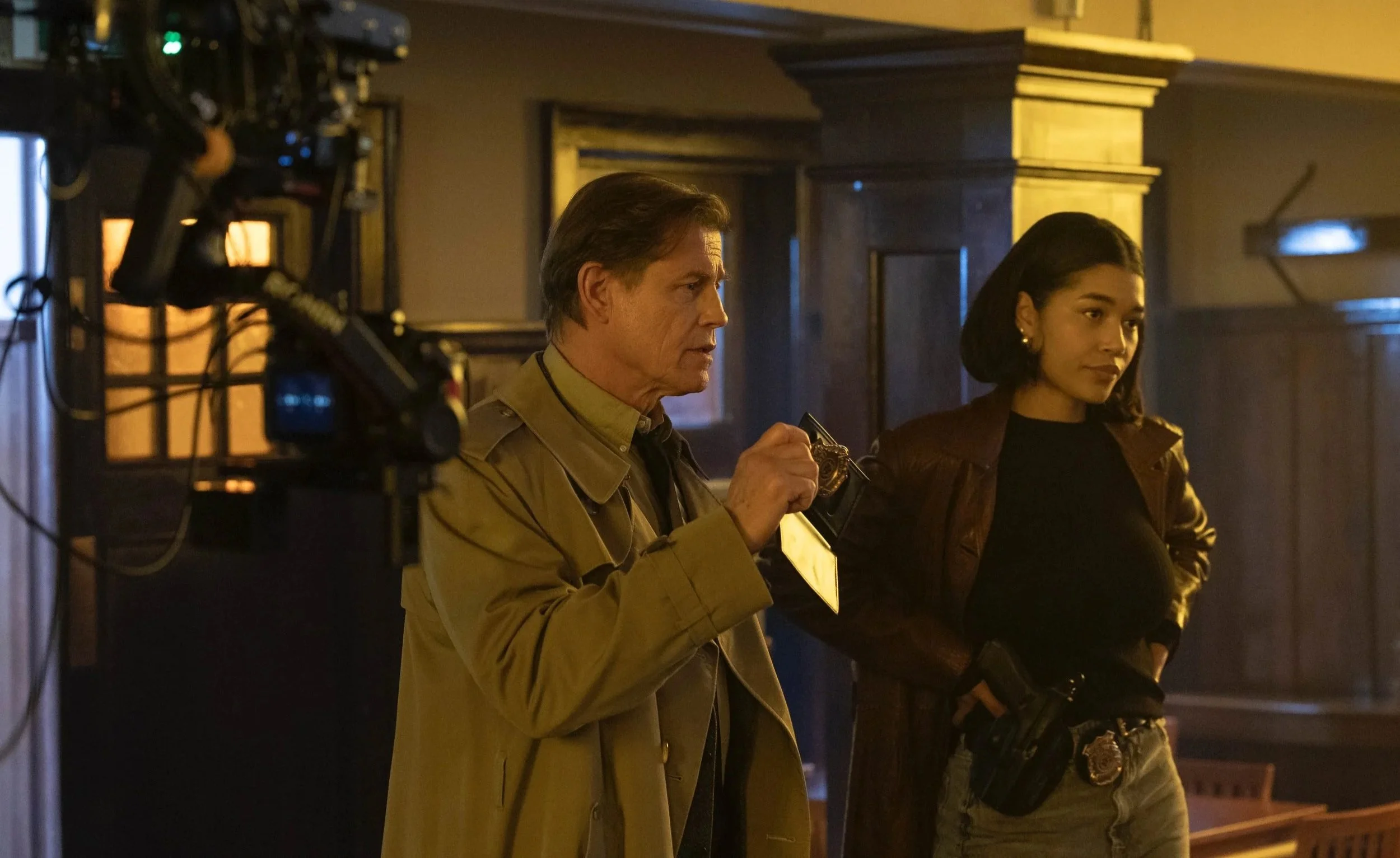 Savannah Bangoura in a police scene with actor Michael Paré.