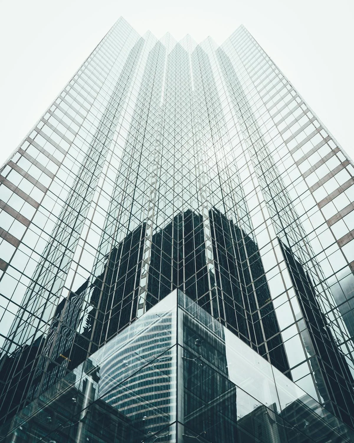 Tall, glass skyscraper from low angle. GLO prepares and reviews Asset Purchase Agreements and assists with Business Purchases and Sales. Contact Geraghty Law Office: Real Estate & Business Law. Trusted Legal Support in Denver, Colorado.