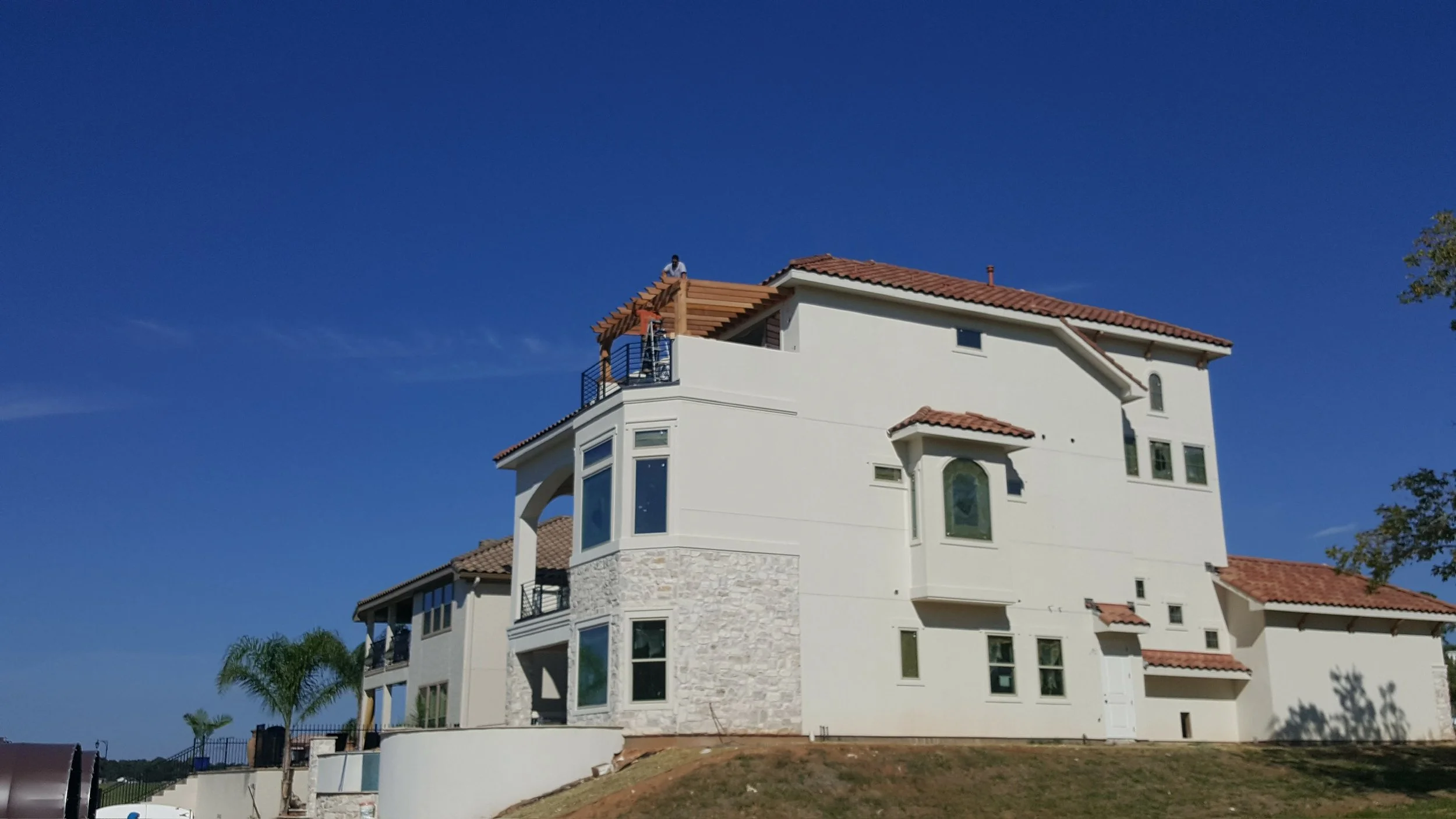 Addition of custom wood rooftop pergola.