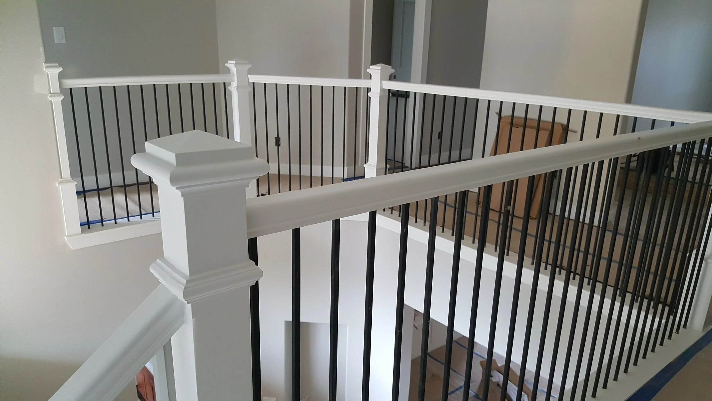 New stair, landing and second story landing railing & bannisters. Iron & painted wood.
