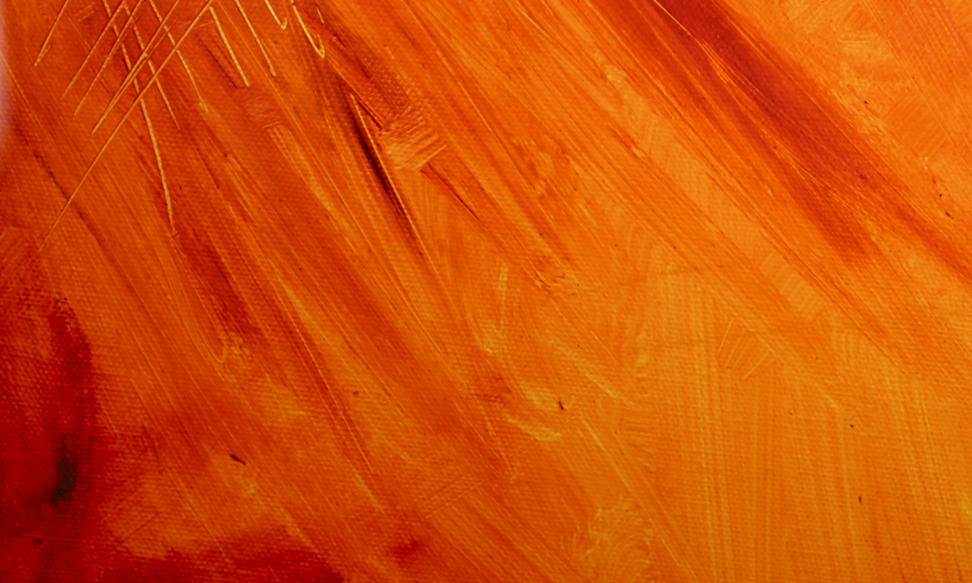 Close-up of an orange-colored wooden surface with visible wood grain and texture.