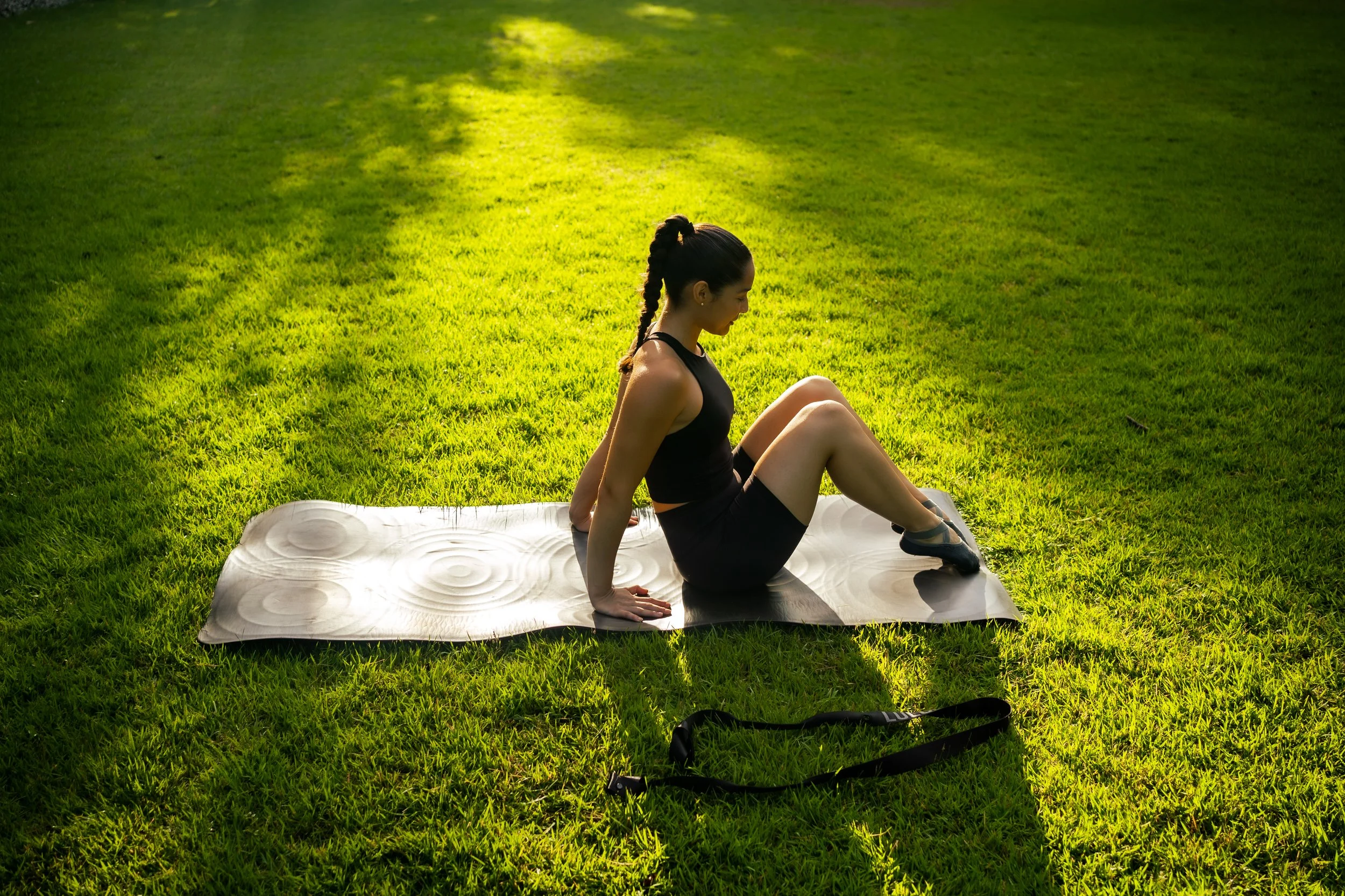 Mat pilates vs yoga mat lesson on a miami park green grass