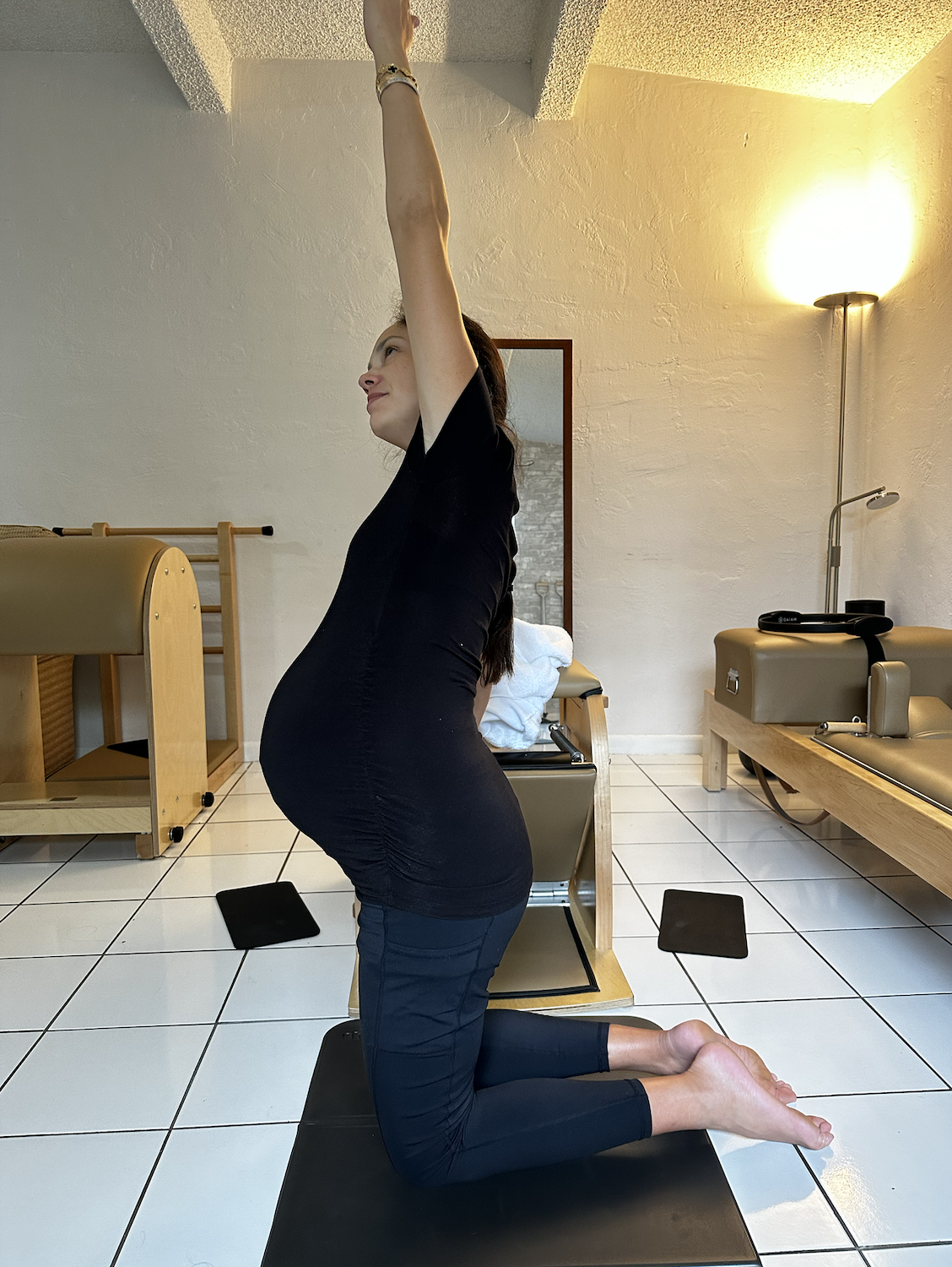 postpartum mom pilates in miami private pilates lesson wunda chair