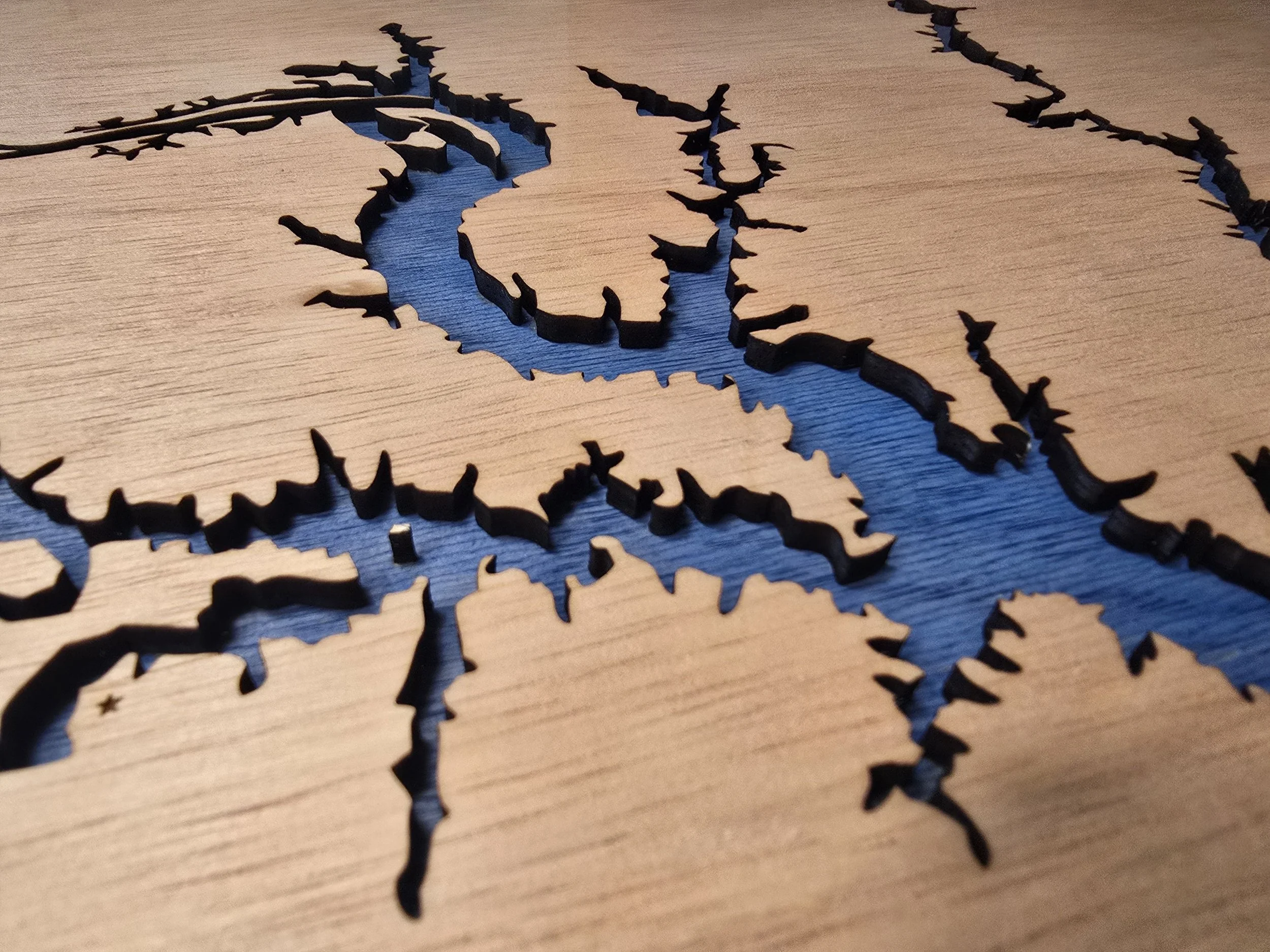 Close-up of a laser engraved wooden lake map featuring High Rock Lake, NC.